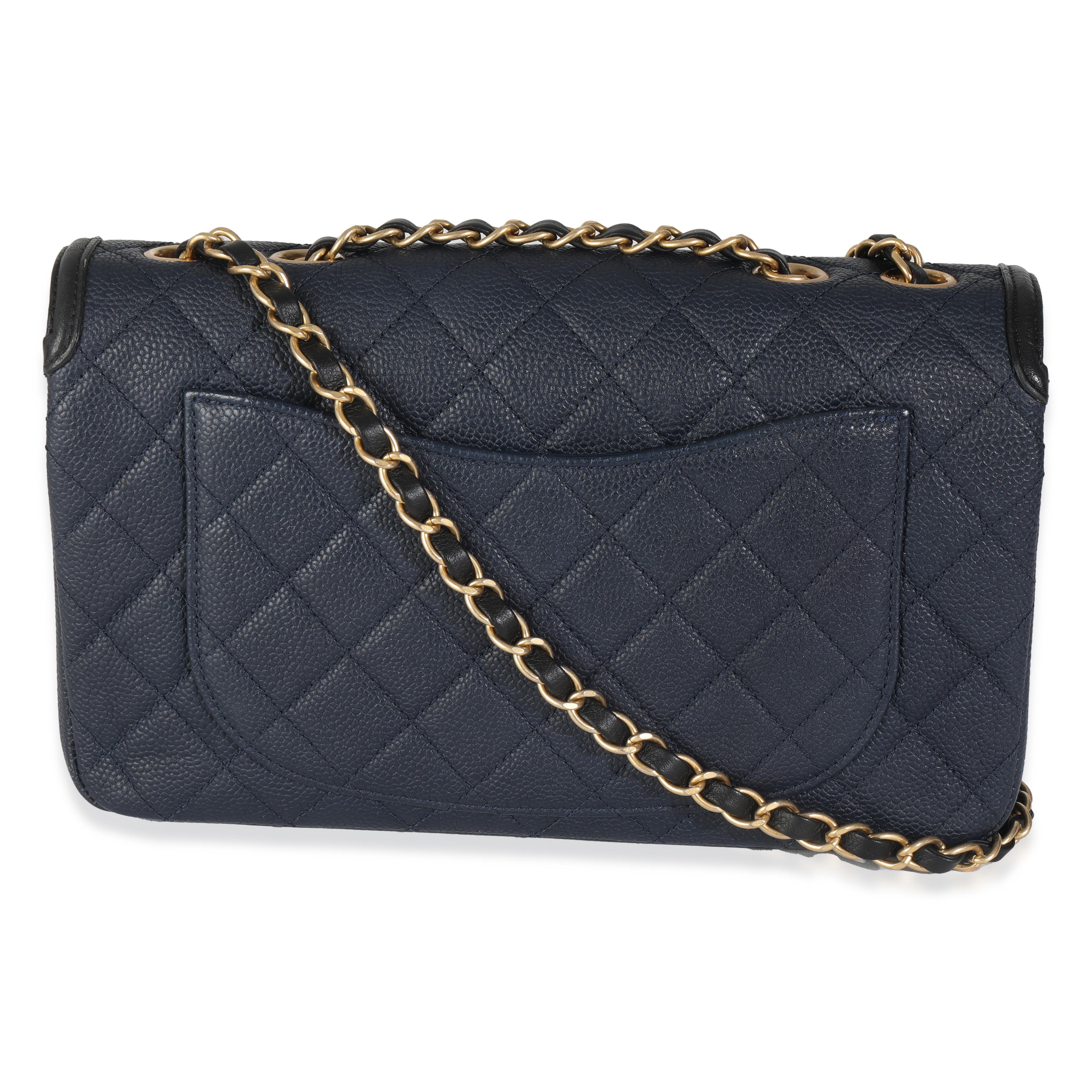 Listing Title: Chanel Navy Black Quilted Caviar Medium CC Filigree Flap Bag
SKU: 145072
Condition: Pre-owned 
Condition Description: A timeless classic that never goes out of style, the flap bag from Chanel dates back to 1955 and has seen a number
