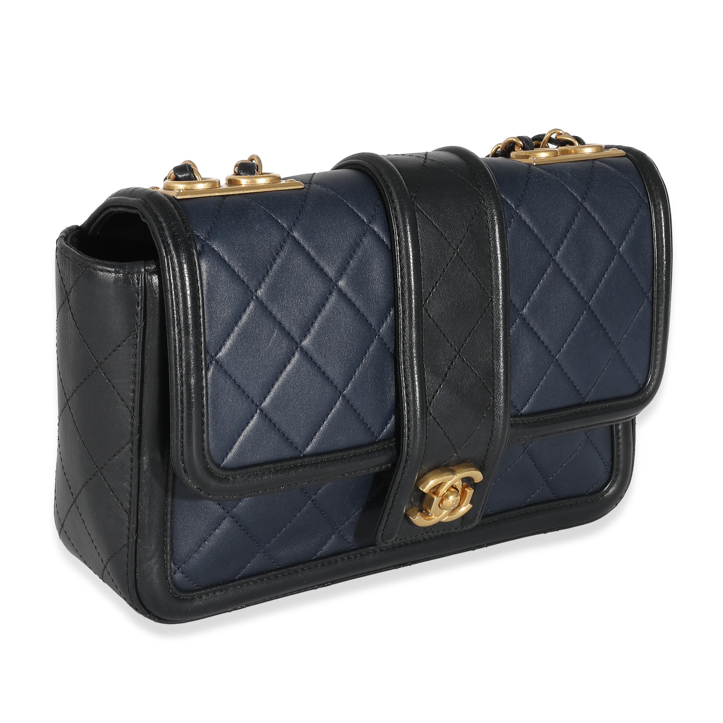 Listing Title: Chanel Navy Black Quilted Lambskin Medium Elegant CC Flap Bag
SKU: 134683
Condition: Pre-owned 
Condition Description: A timeless classic that never goes out of style, the flap bag from Chanel dates back to 1955 and has seen a number