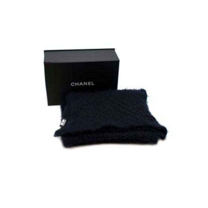 Chanel Navy & Black Sparkle Boucle Knit Scarf 
 

 - Luxuriously soft chunky boucle knit scarf in navy blue with a black and sparkle pattern
 - Black knit logo on one corner 
 - Comes in box 
 

 No care label but estimated as a wool blend 
 

