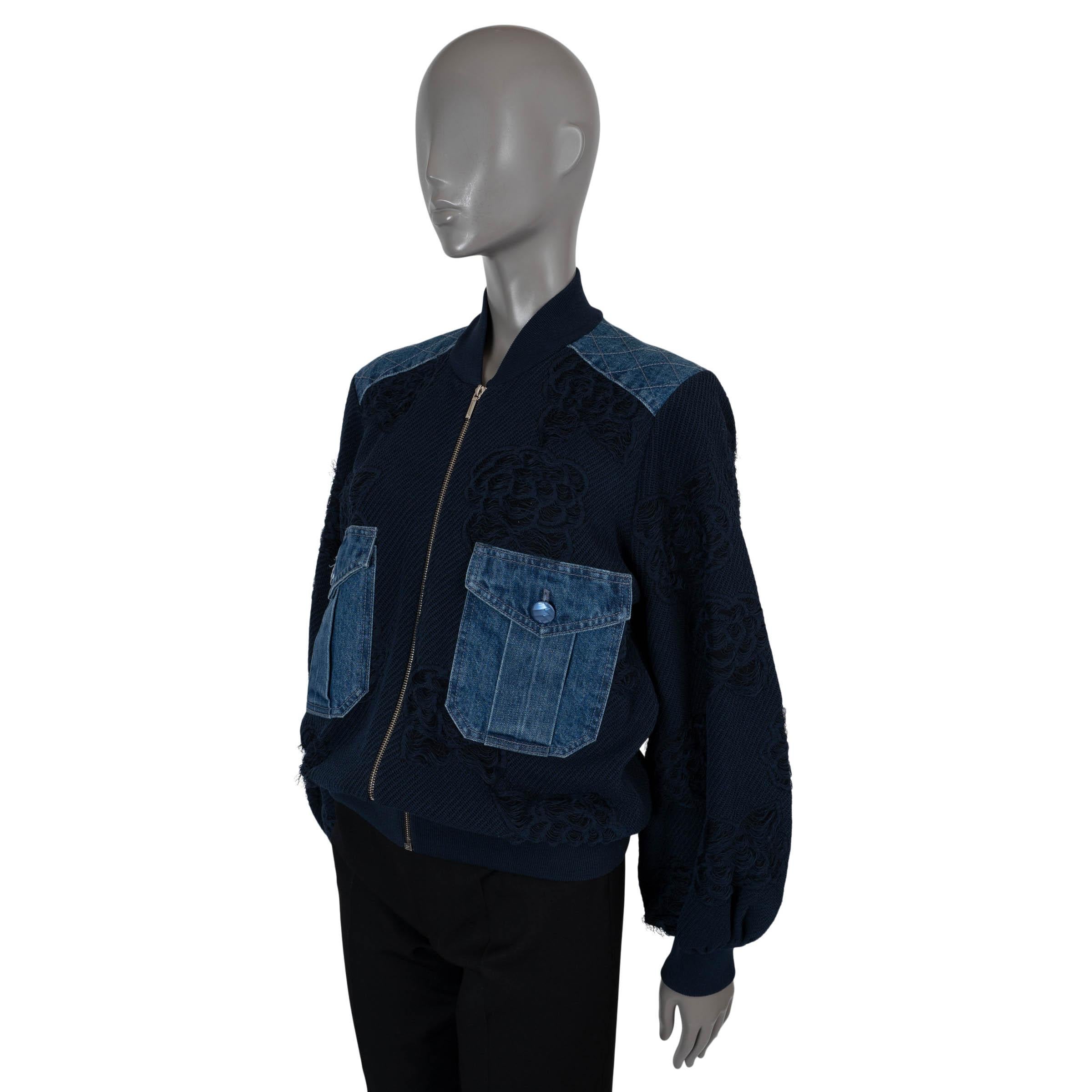 100% authentic Chanel Camellia bomber in navy blue twill paper (47%), cotton (43%) and polyamide (10%). Feature two buttoned flap pockets and shoulder patches in denim cotton (100%) and rib-knit neck, cuffs and hem. Closes with a zipper on the front