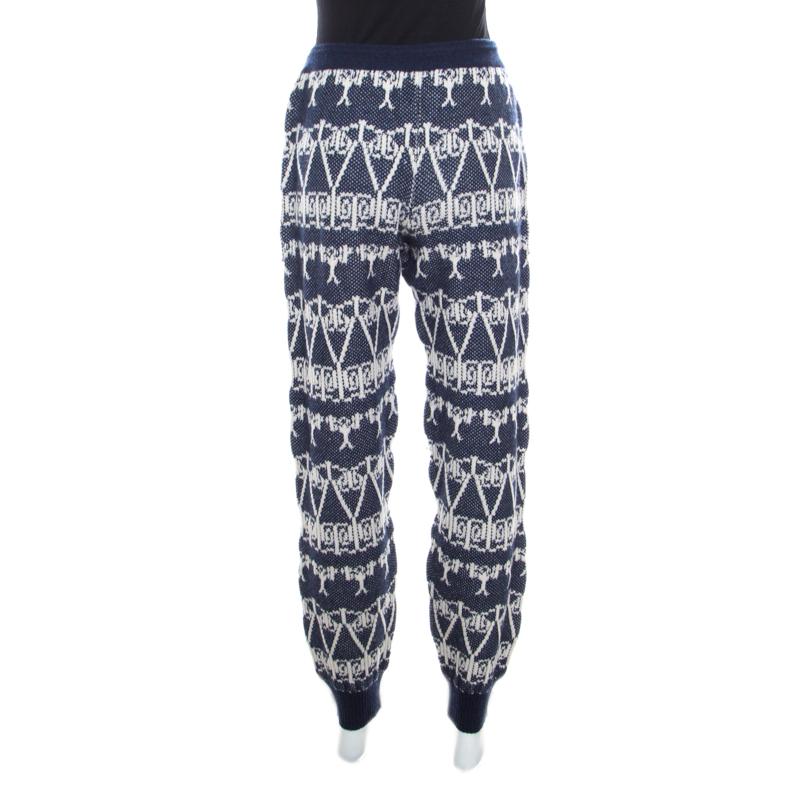 To give you comfort and high style, Chanel brings you this creation that has been made from 100% cashmere and detailed with a chunky jacquard knit pattern. This pair of navy blue and white jogger pants will surely be a delightful buy.

Includes: The