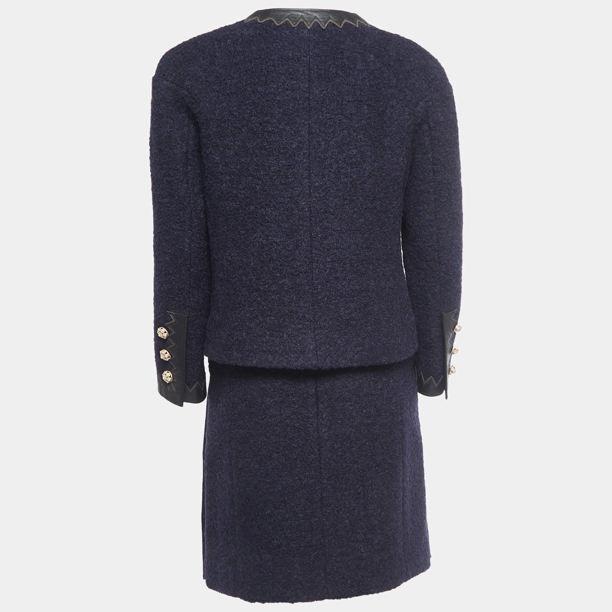 Characterized by impeccable tailoring, a good fit, and the use of silk and lambskin, this Chanel wool skirt suit will help you serve stylish looks. Style the set with heels or flats for max appeal.

