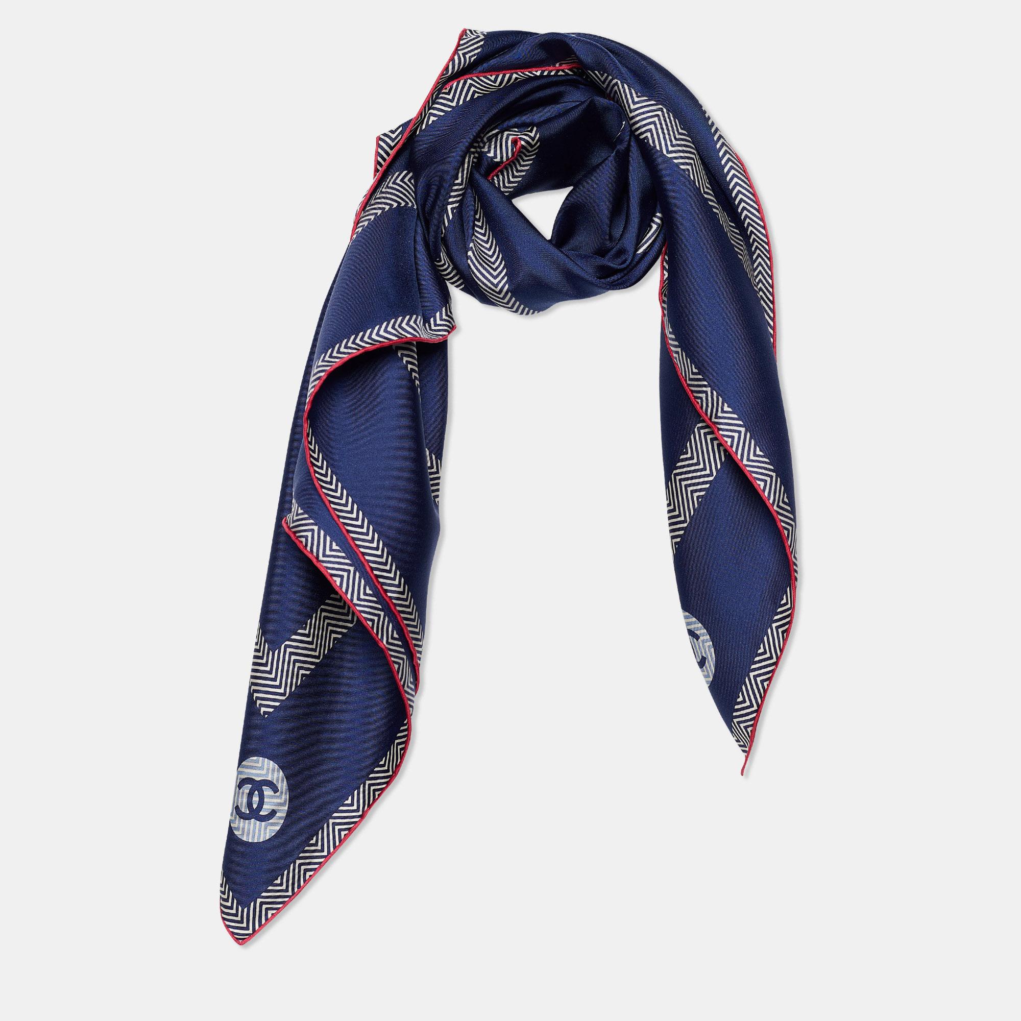 The perfect punctuation to your stylish look will be this Chanel scarf! It has been stitched using soft silk in a navy blue shade and adorned with iconic CC logo prints. Wrap it around your neck to accessorize the chic way!


