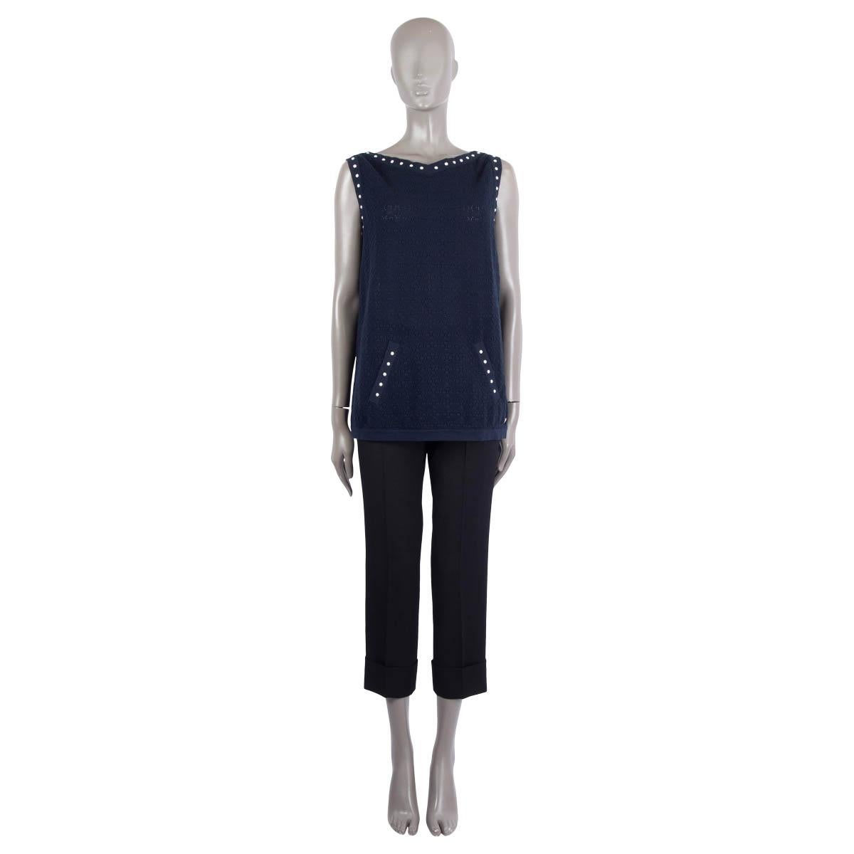 100% authentic Chanel sleeveless oversized crochet knit top in midnight blue cotton (100%). Features pearl embellishments, a front pocket and logo button at the waist. Has been worn and is in excellent condition.

2016