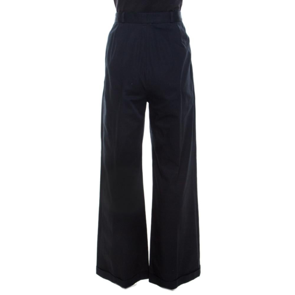 Chanel exudes class with all of its creations, just like this one. Wide-leg fit, enticing navy blue color, chic design and fine finishing, everything just leads to perfection. Tailored from cotton, these high waisted trousers will go well for work