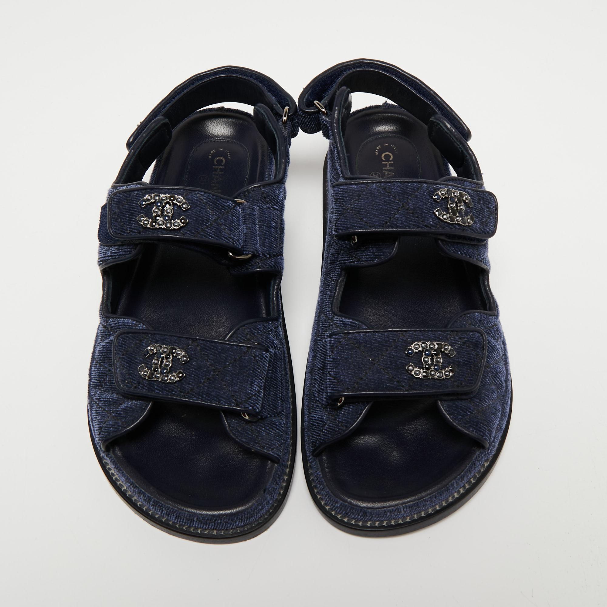 An ideal summer footwear, the Dad sandals were introduced by Chanel in Summer 2019. These navy blue shoes are made from denim with a trendy design and will easily set you apart from the crowd. This pair is complete with chunky soles and branded