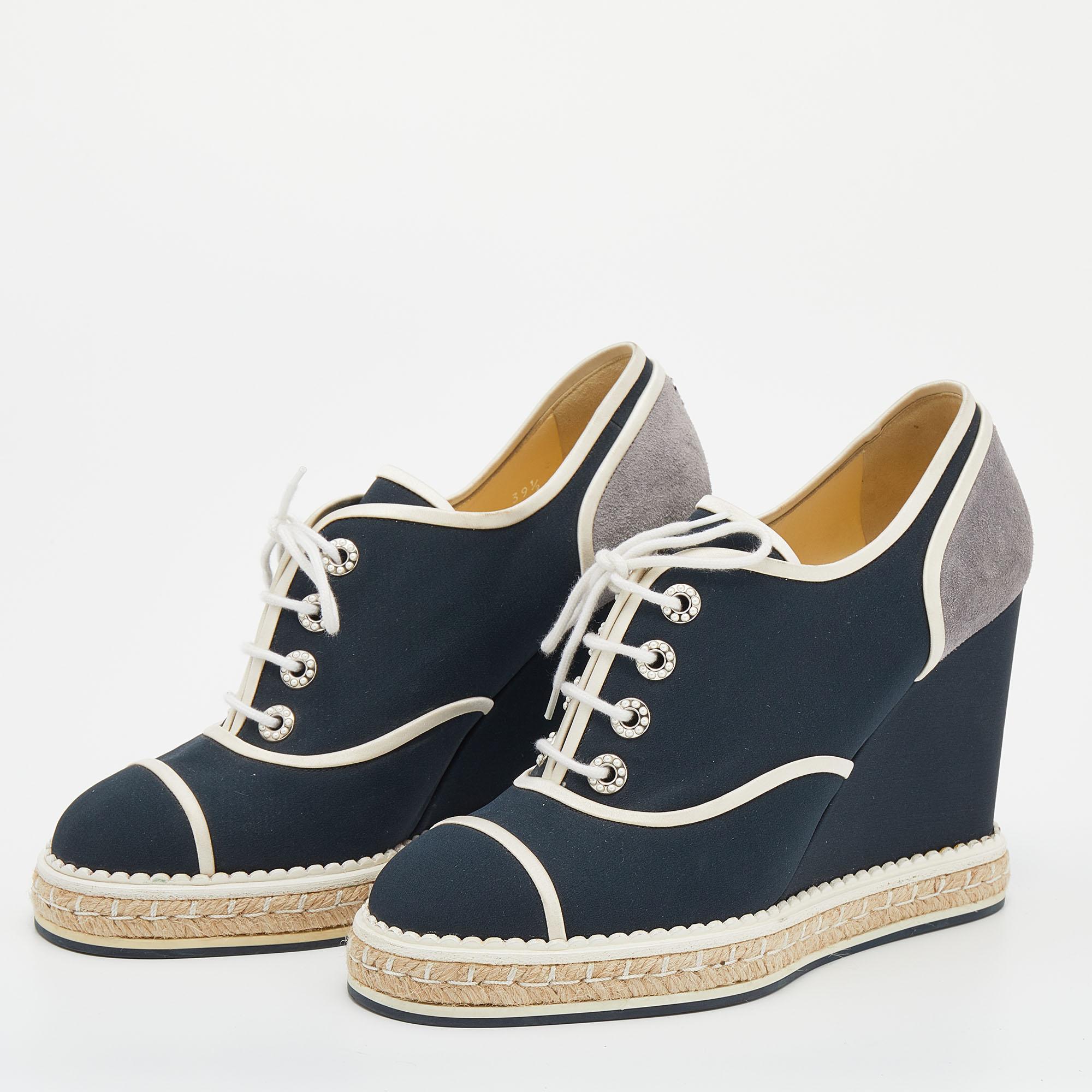 These sneakers from Chanel are both stylish and comfortable! They are crafted from fabric as well as suede and designed in a round-toe silhouette. Simple lace-ups and 11 cm wedge heels complete them.

Includes: Original Dustbag