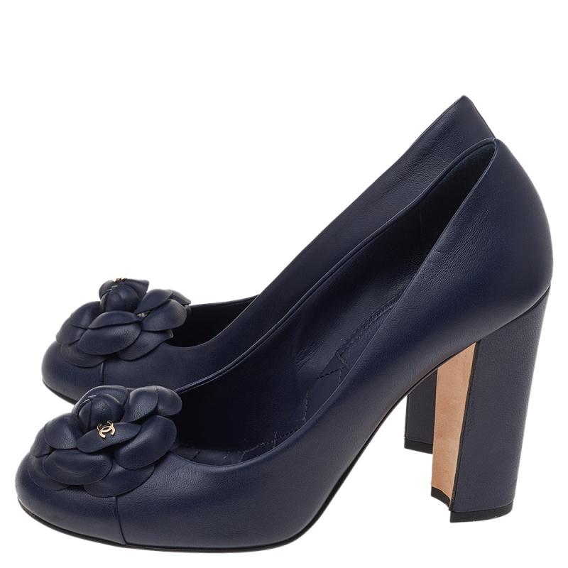 The House of Chanel knows best how to create styles that leave you in awe of them. These pumps from Chanel are indeed a sight to behold. They are crafted using navy-blue leather with the Camellia motif and a dainty gold-toned logo accent perched on