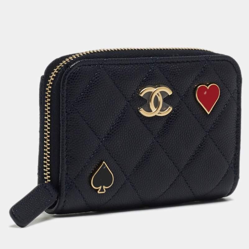 The Chanel coin purse is an exquisite accessory. Crafted from luxurious caviar leather, it features a quilted texture and playing card charms. The iconic CC logo embellishes the zip, making it a timeless and stylish choice for storing coins and