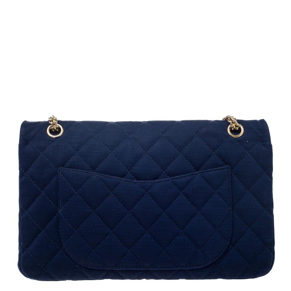 Chanel's Flap Bags are iconic and noteworthy in the history of fashion. Hence, this Reissue 2.55 is a buy that is worth every bit of your splurge. Exquisitely crafted from navy blue fabric, it bears their signature quilt pattern and the iconic