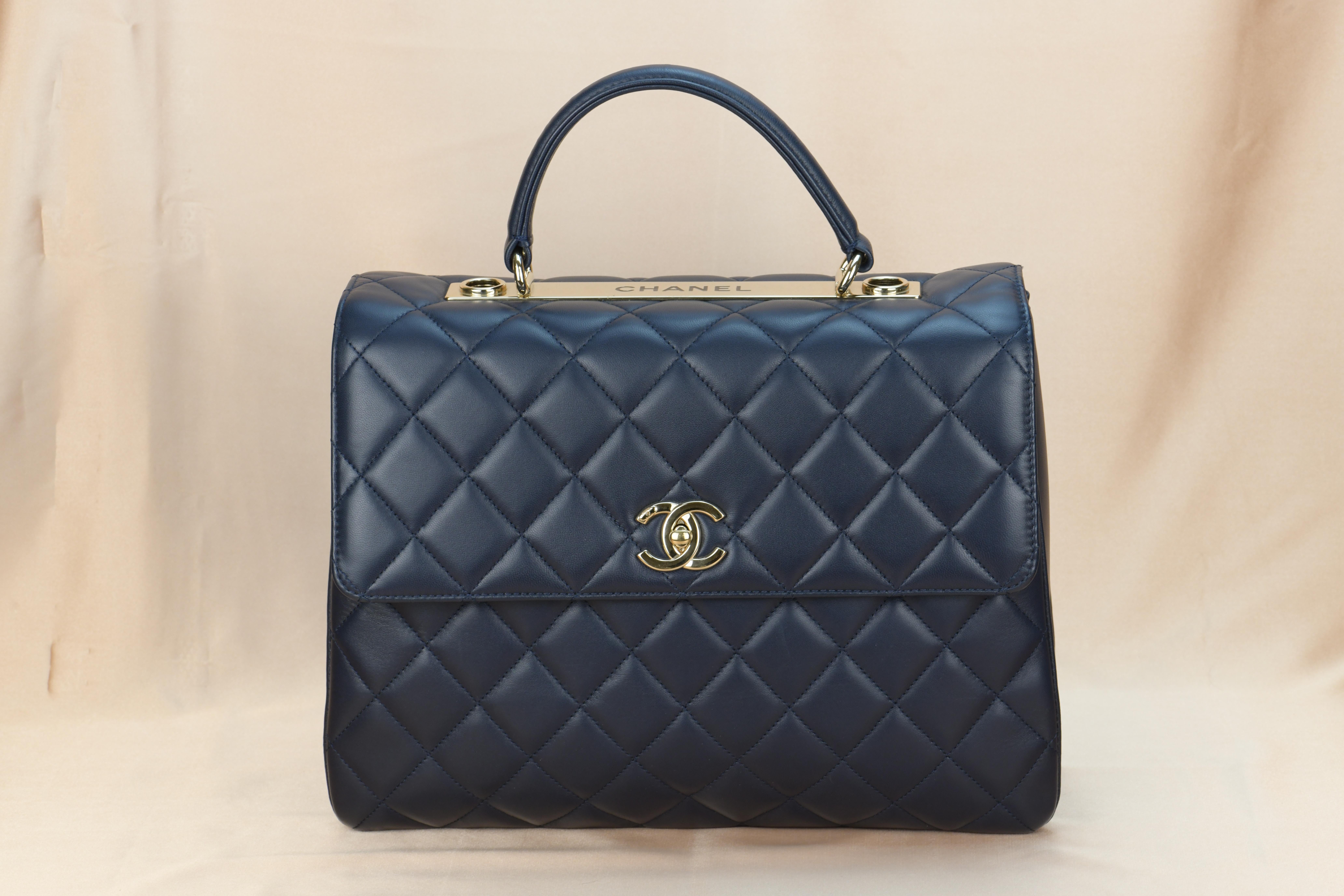 Dandelion Code	AT-1120
Brand	Chanel
Model	Trendy CC Top Handle
Serial No.	20******
Color	Navy Blue
Date	Approx. 2014
Metal	Gold
Material	Lambskin Leather
Measurements	Approx. 26  x 31 x 16cm
Condition	Excellent 
Comes with	Chanel Dust bag / Chanel