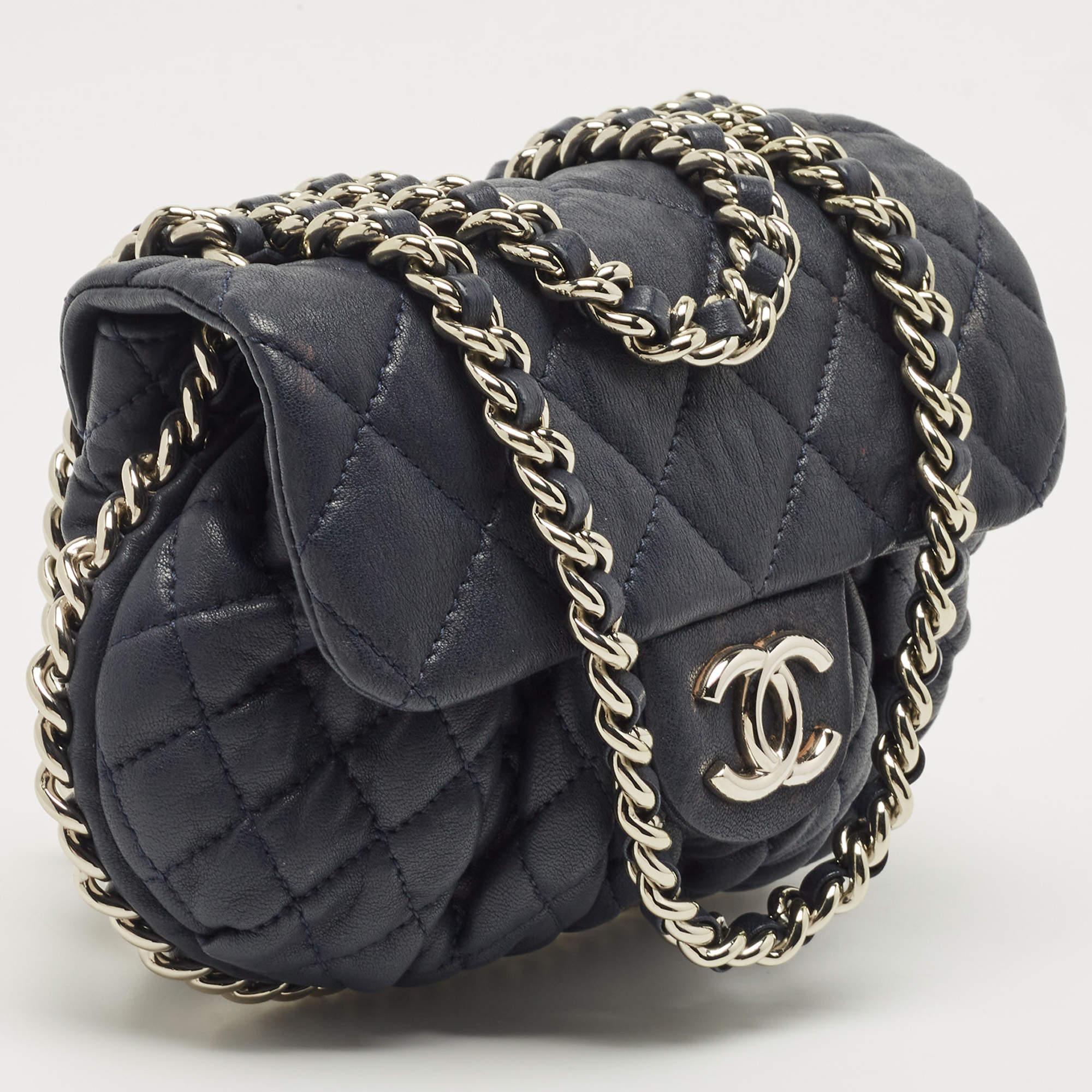 Indulge in luxury with this Chanel Chain Around bag. Meticulously crafted from premium materials, it combines exquisite design, impeccable craftsmanship, and timeless elegance. Elevate your style with this fashion accessory.

