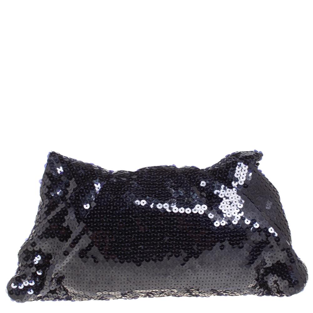Why just stop at owning a Chanel bag when you can also carry your essentials in a lovely clutch bearing the signature quilt on a spread of sequins! This Half Moon creation from Chanel is truly one accessory you will love to flaunt. Covered in navy