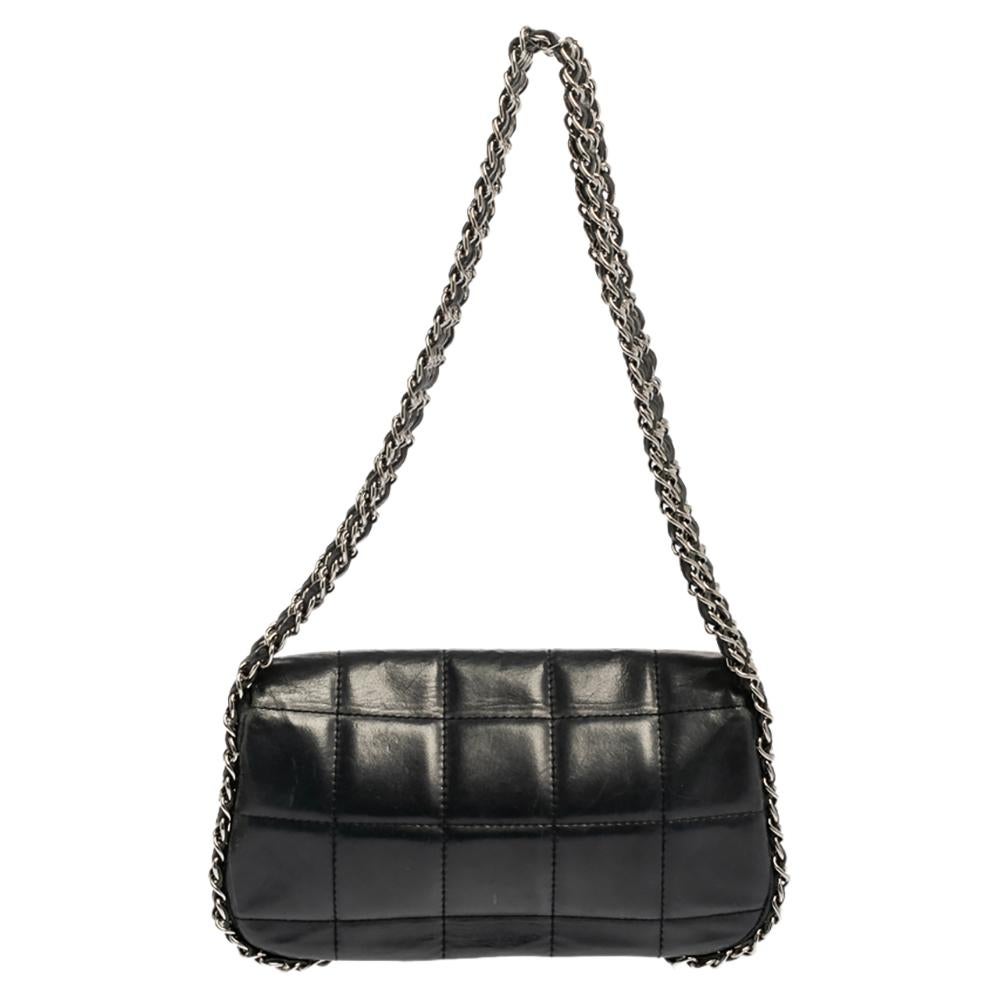 This timeless Chanel Multi Chain Flap Bag is crafted from navy blue leather with a square quilted design all over. It features a row of five woven chain links that start from the bottom to the handles. The interior is lined with canvas and features