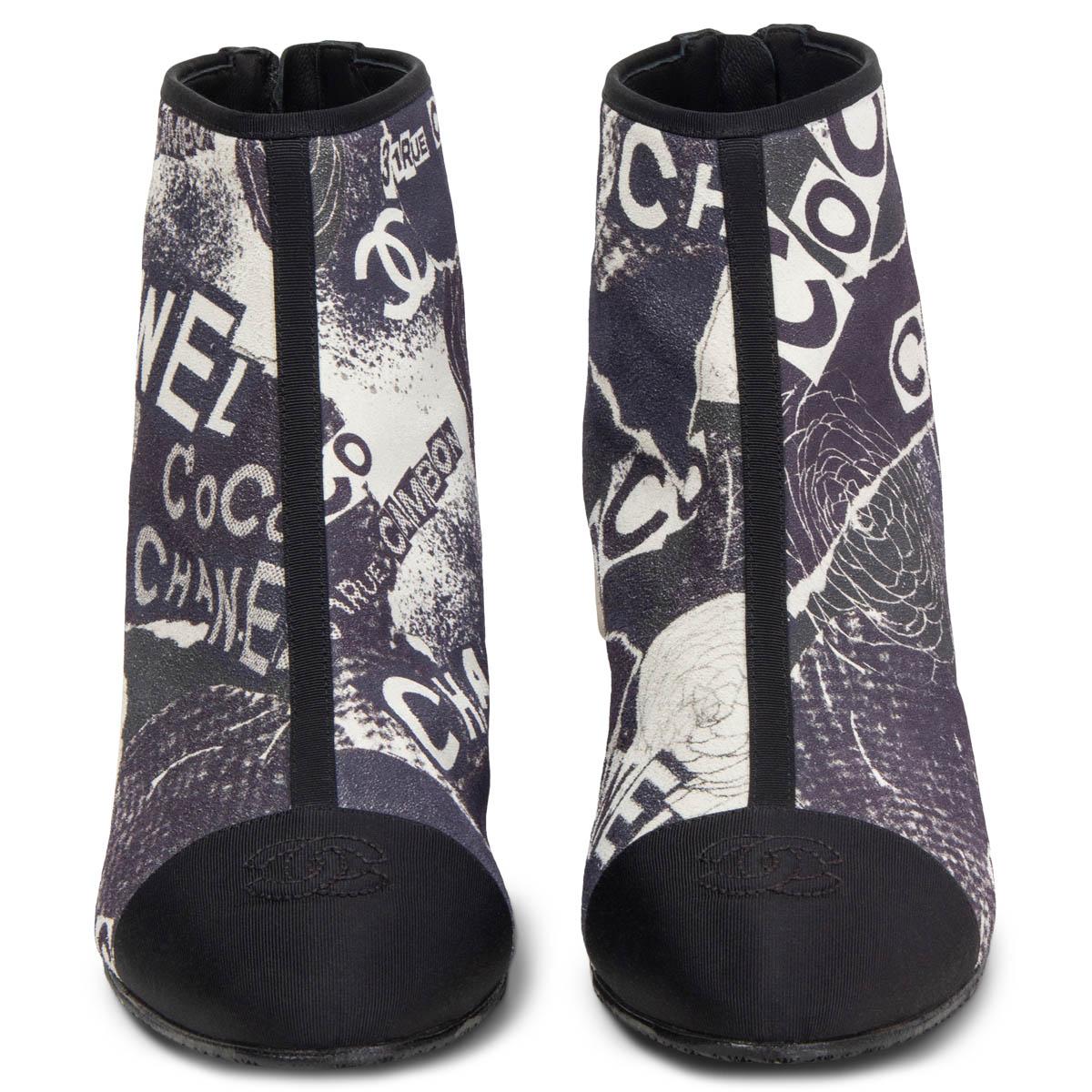 100% authentic Chanel ankle boots in navy and white printed suede with black grosgrain CC toe cap, trims and heels. Open with a zipper at the heel. Brand new. Rubber sole got added. Come with dust bags.

Measurements

Imprinted Size	39
Shoe