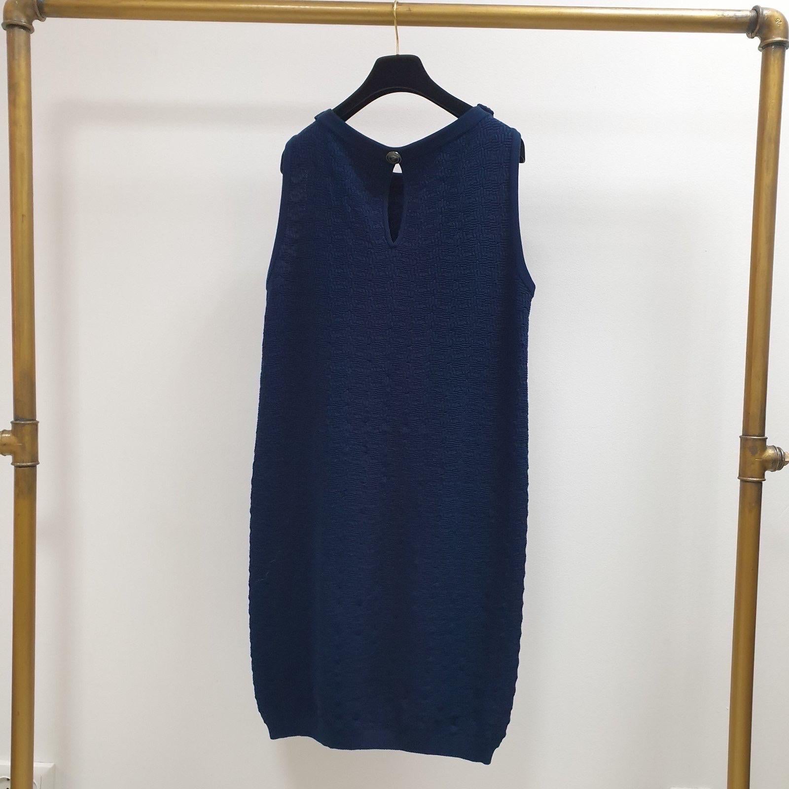 Minimally divine in a navy blue knit, this dress is a luxurious but practical investment that you can wear season after season. 
Cut in a relaxed it is fashioned with oversized ribbed patch pockets and shoulders that add a hint of drama to your