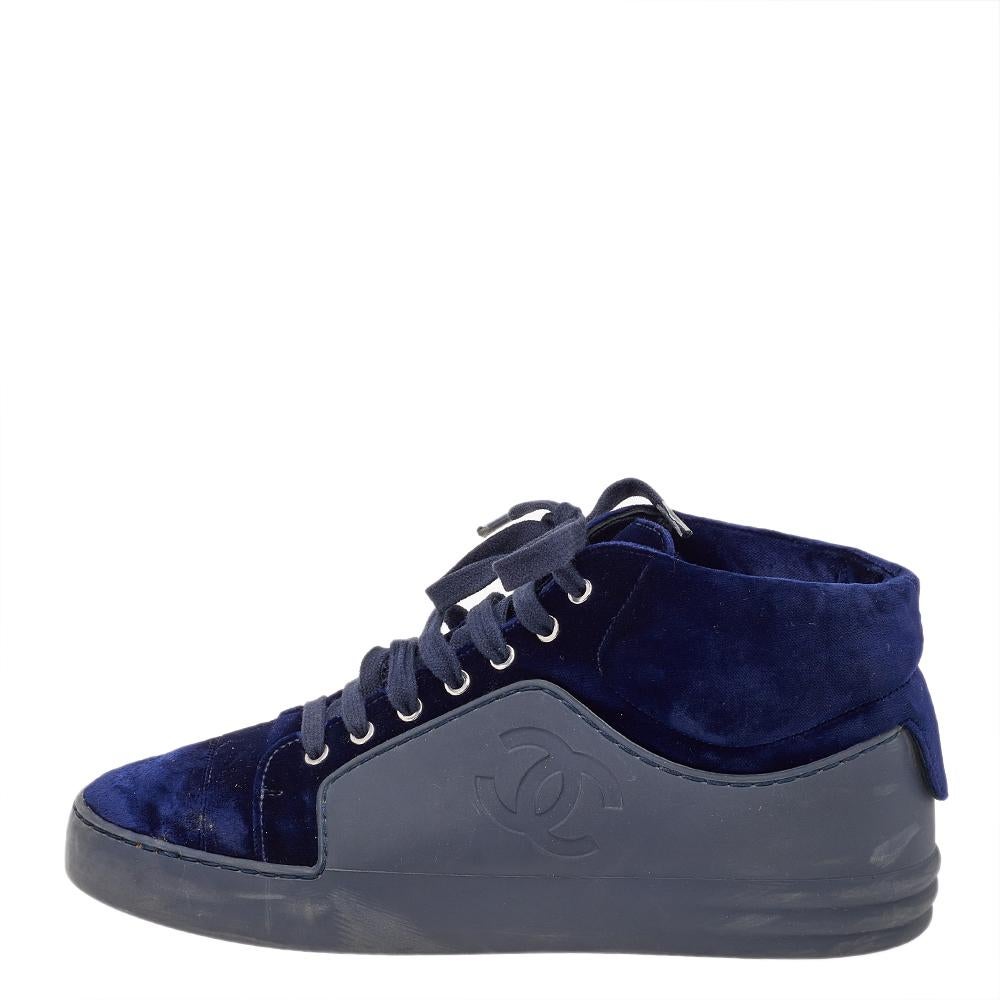 Add a touch of luxury to your casual-sporty look with these stunning Chanel sneakers. Beautifully constructed with velvet and rubber, they feature rounded toes, the CC logo on the sides, and rubber soles. The lace-ups complete the pair with