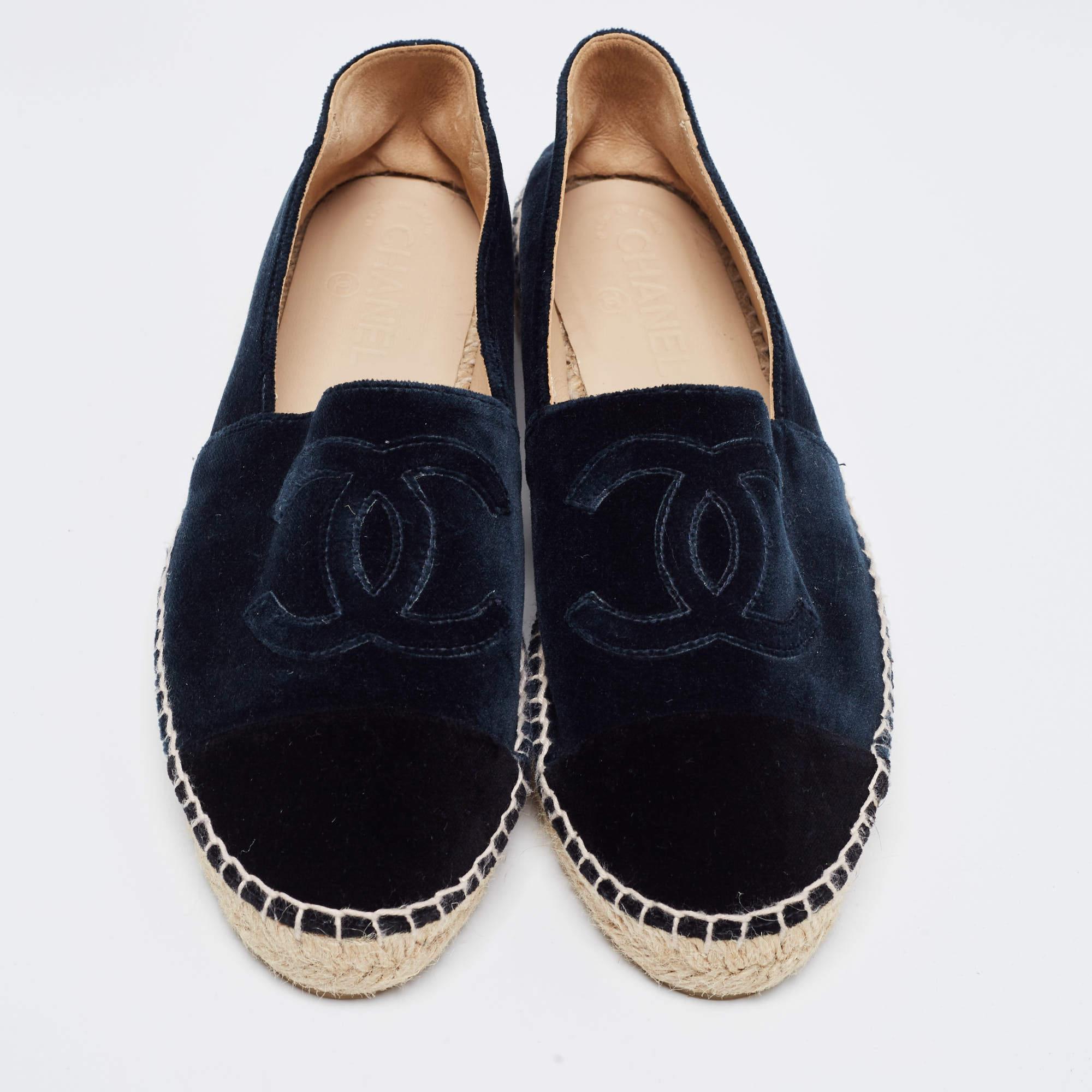 Let comfort and classic style be yours with these designer espadrille flats from Chanel. Crafted with skill, the high-quality shoes have the perfect construction to take you through the day with utmost ease.

Includes: Original Dustbag

