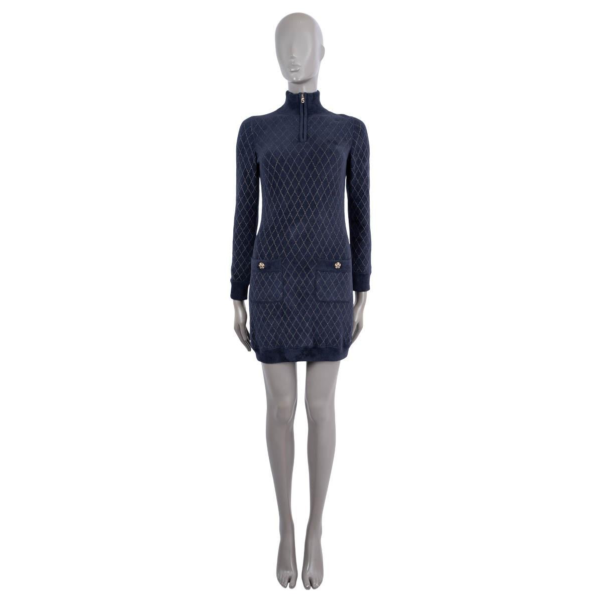 100% authentic Chanel 2019 long sleeve mini dress in navy blue stretchy, soft & fluffy terry cloth viscose (66%), polyamide (33%) and polyester (1%) with quilted golden lurex pattern. The design features a ribbed stand-up collar, cuffs, hem and two