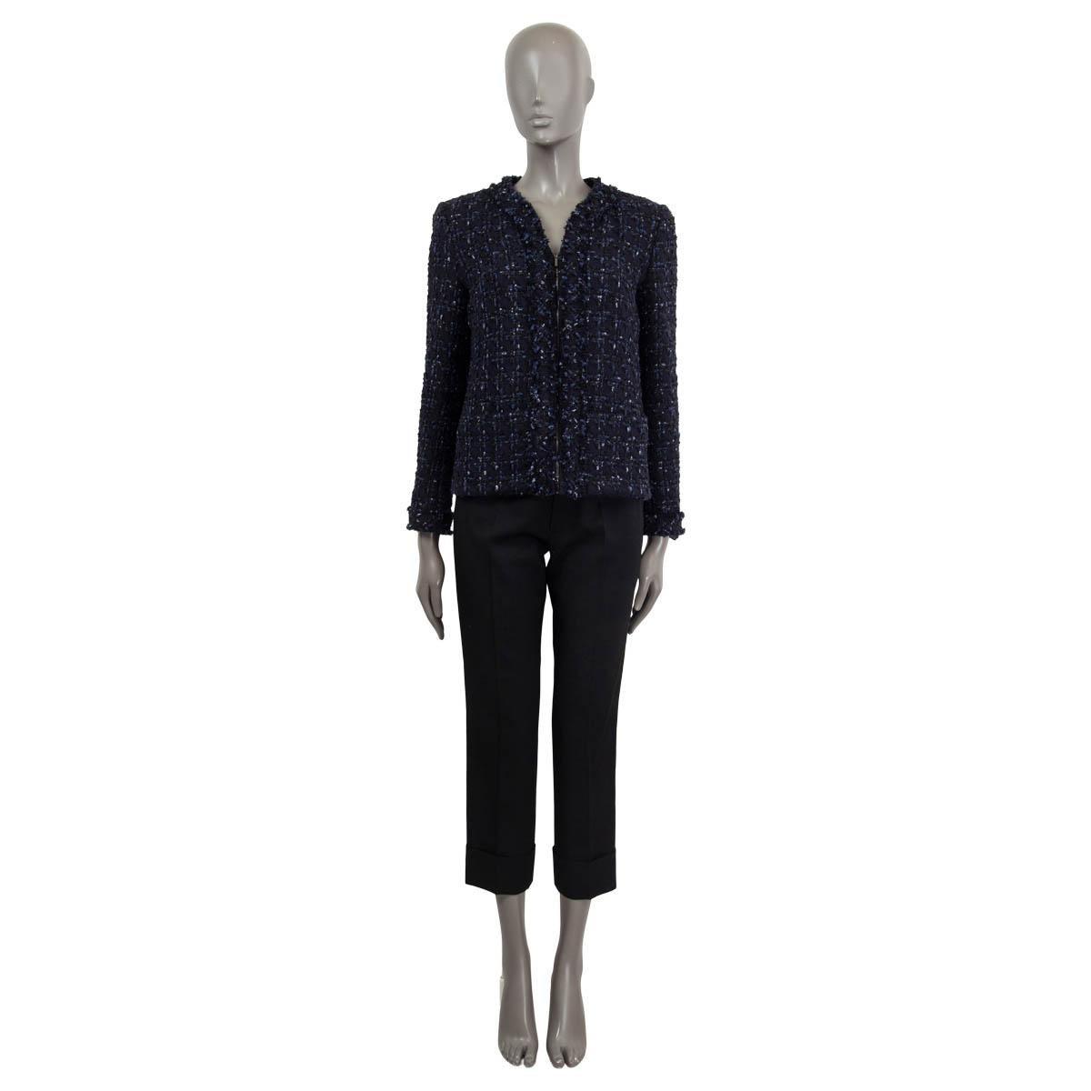 100% authentic Chanel lurex tweed jacket in navy blue, black and silver wool (40%), nylon (36%), viscose (12%), polyester (6%) and polyurethane (6%). Features patch pockets on the front and buttons on the cuffs. Closes with concealed zipper on the