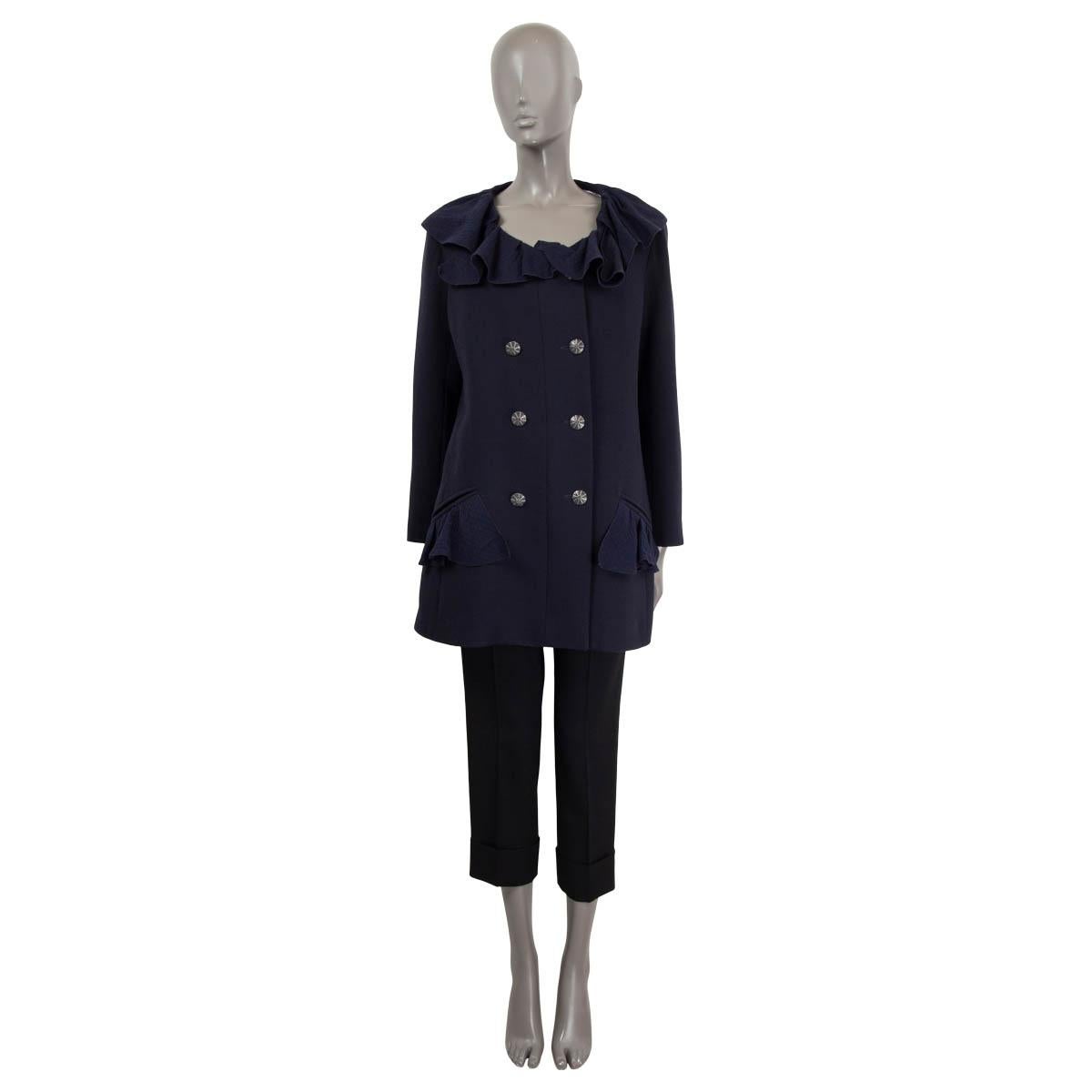 100% authentic Chanel 2020 ruffled double-breasted jacket in navy wool (100%) and details in silk (100%). Opens with embellished gunmetal buttons to a black & white striped logo lining in cotton (100%). The design features two slit front pockets