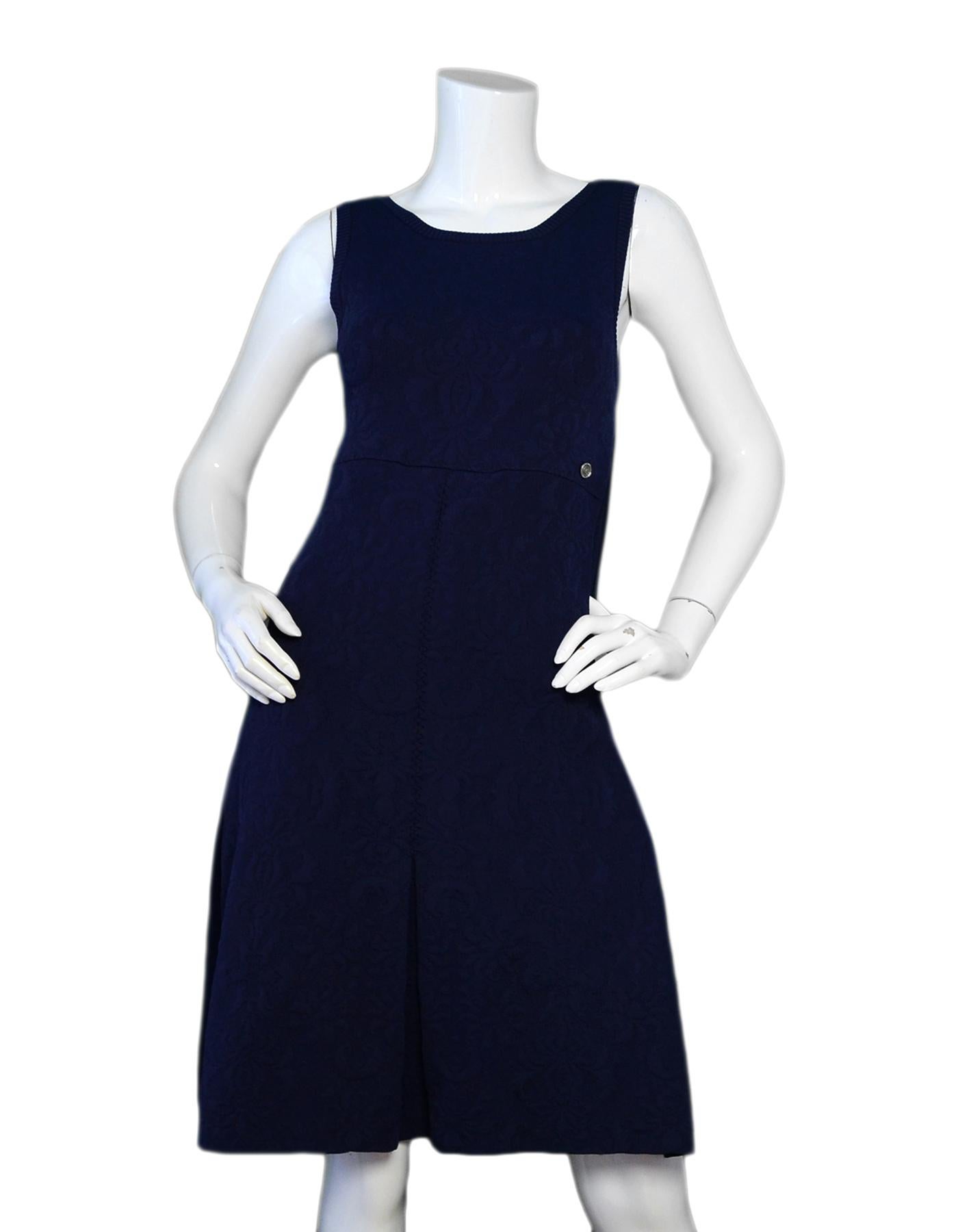 Chanel Navy Brocade Textured Sleeveless Skater Dress sz 36

Made In: France
Color: Navy blue
Materials: 56% viscose, 35% polypropylene, 9% polyamide
Opening/Closure: Side hidden zip closure
Overall Condition: Very good pre-owned condition, with seam