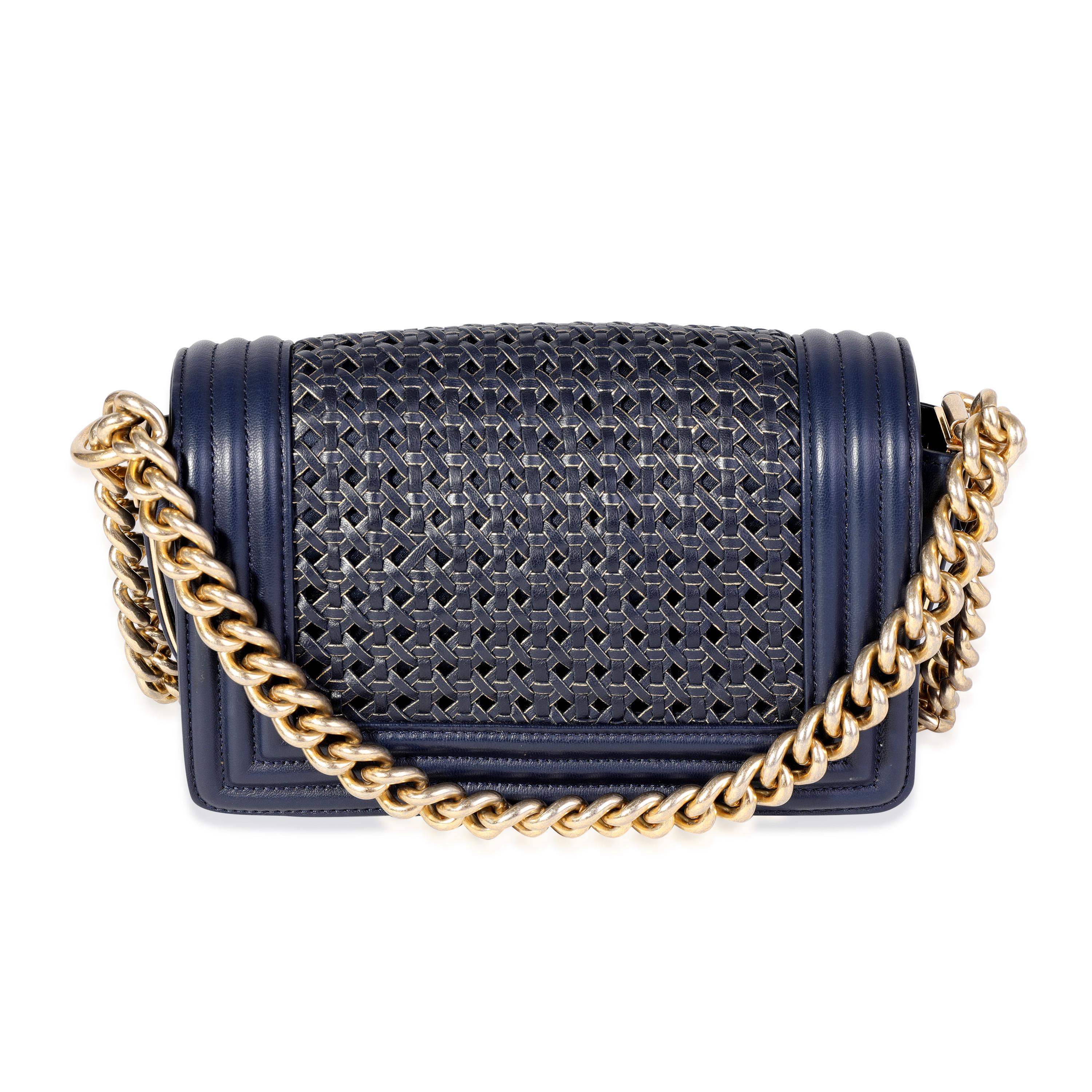 Listing Title: Chanel Navy Calfskin & Gold Metallic Woven Small Boy Bag
SKU: 120828
Condition: Pre-owned 
Handbag Condition: Good
Condition Comments: Good Condition. Plastic to some hardware. Light scuffing and marks to exterior. Scratching to