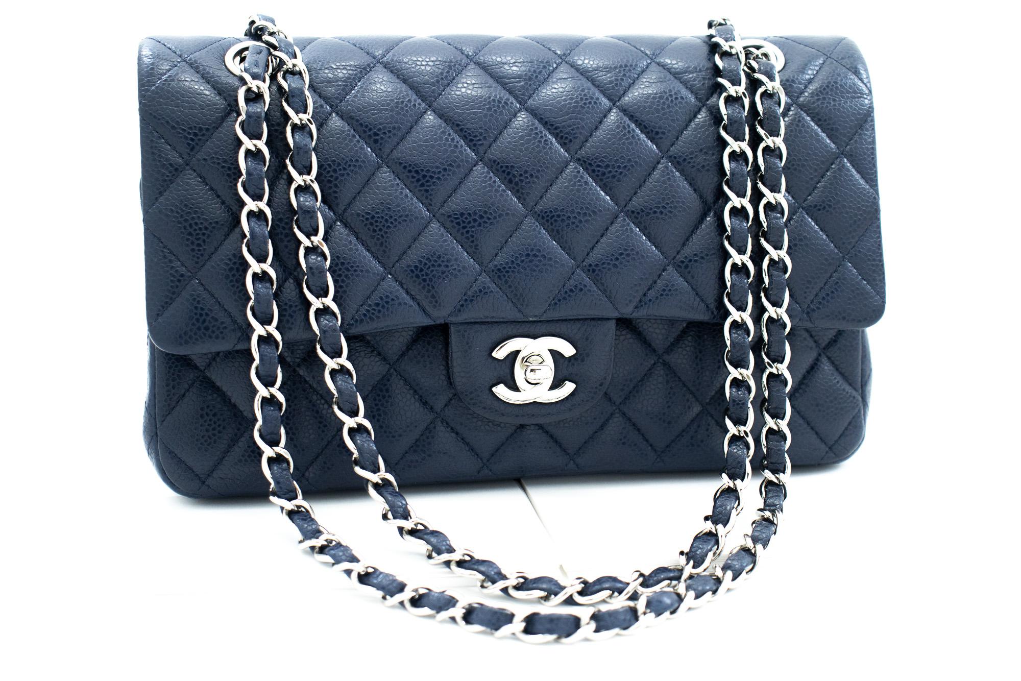 An authentic CHANEL Navy Caviar Double Flap Chain Shoulder Bag Quilted Leather. The color is Navy. The outside material is Leather. The pattern is Solid. This item is Contemporary. The year of manufacture would be 2011.
Conditions & Ratings
Outside