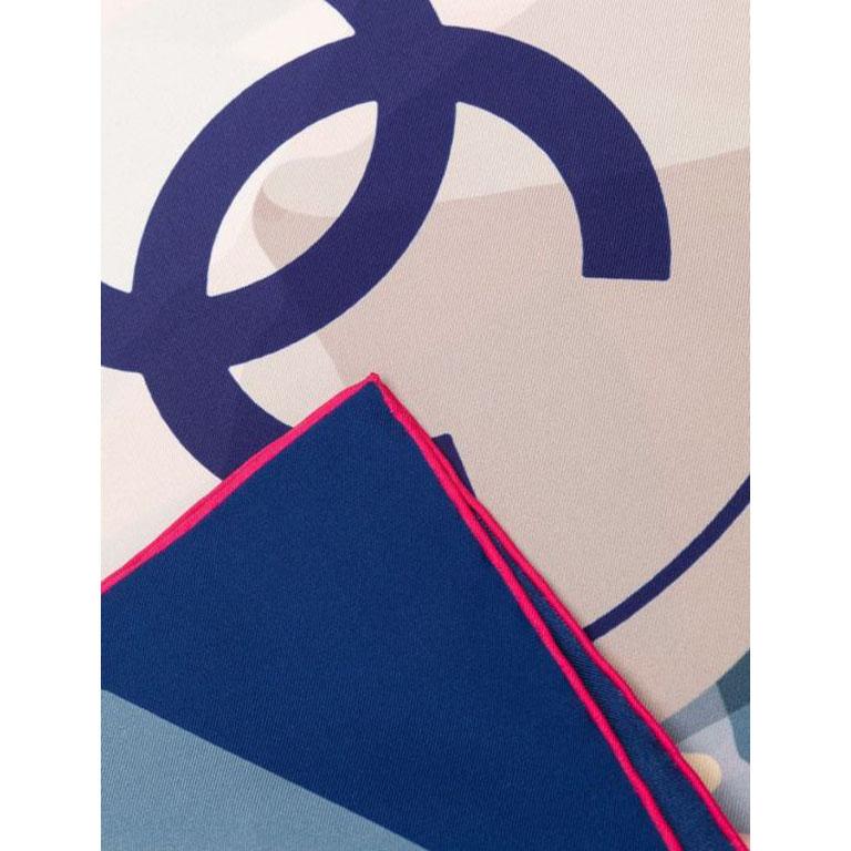 Crafted in Italy from the purest pale-blue silk, this vintage scarf by Chanel features a central graphic optic white 'Cruise' print motif, which is adorned with the signature interlocking CC logo in a contrasting navy, framed by a