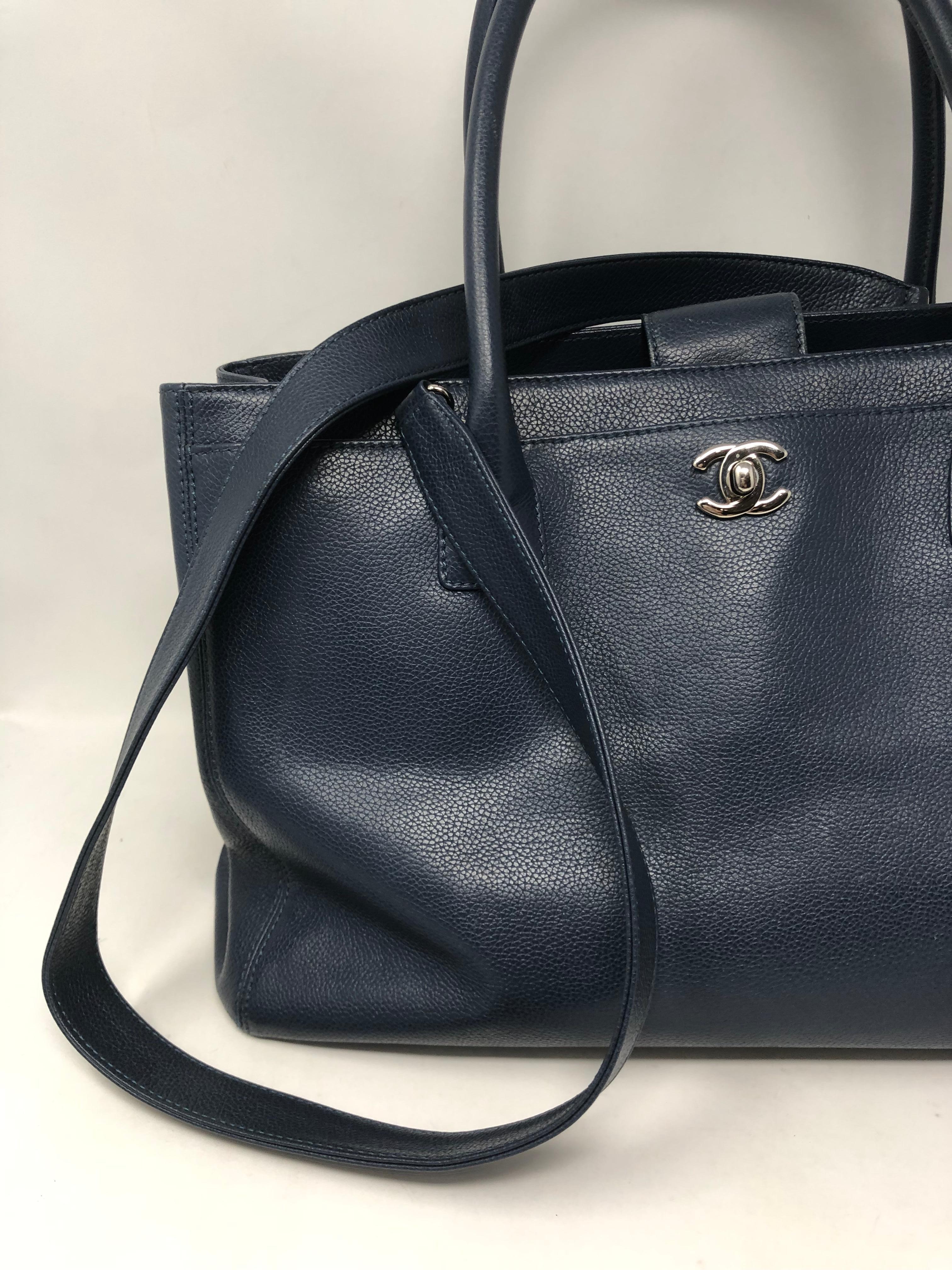 Chanel Navy Cerf Executive Shopper Tote with additional leather strap. Retired style from Chanel. Great looking bag for work or all your needs. Nice neutral navy color. Interior and exterior in excellent condition. Guaranteed authentic. 