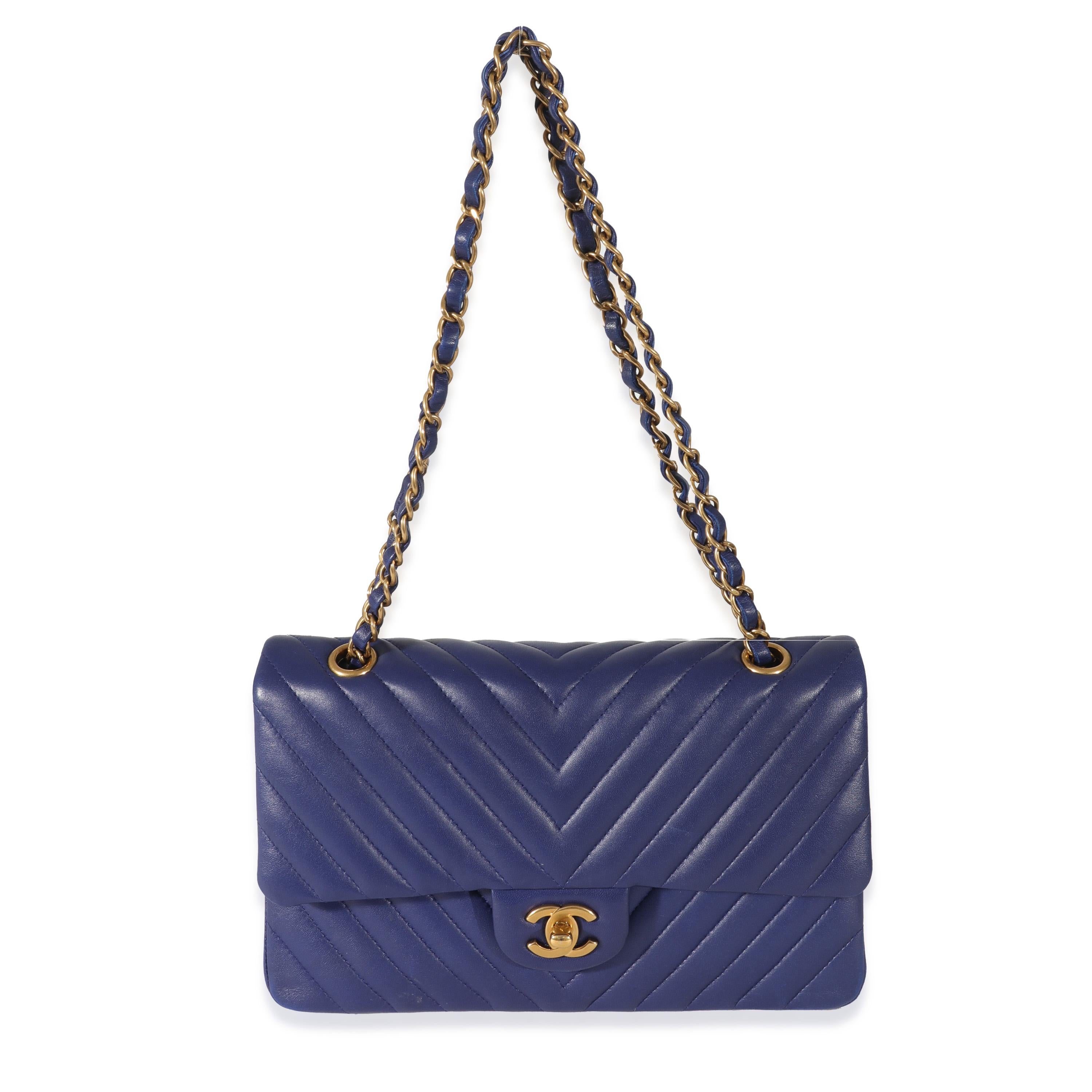 Listing Title: Chanel Navy Chevron Medium Classic Double Flap
SKU: 130459
MSRP: 10200.00
Condition: Pre-owned 
Condition Description: A timeless classic that never goes out of style, the flap bag from Chanel dates back to 1955 and has seen a number