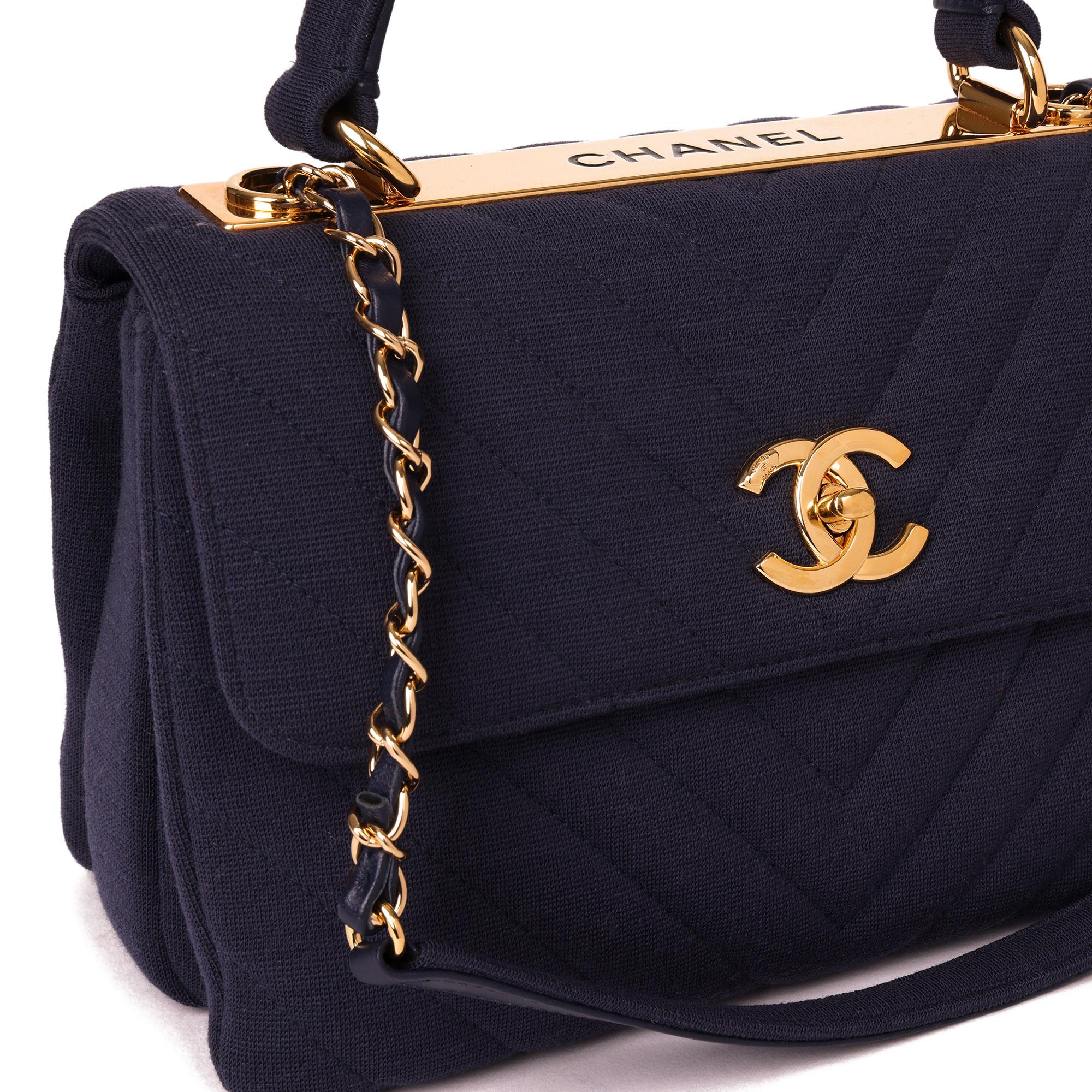 CHANEL
Navy Chevron Quilted Jersey Fabric Small Trendy CC Top Handle Flap Bag

Xupes Reference: HB4001
Serial Number: 26985763
Age (Circa): 2019
Accompanied By: Chanel Dust Bag, Box, Care Booklet, Authenticity Card
Authenticity Details: Serial