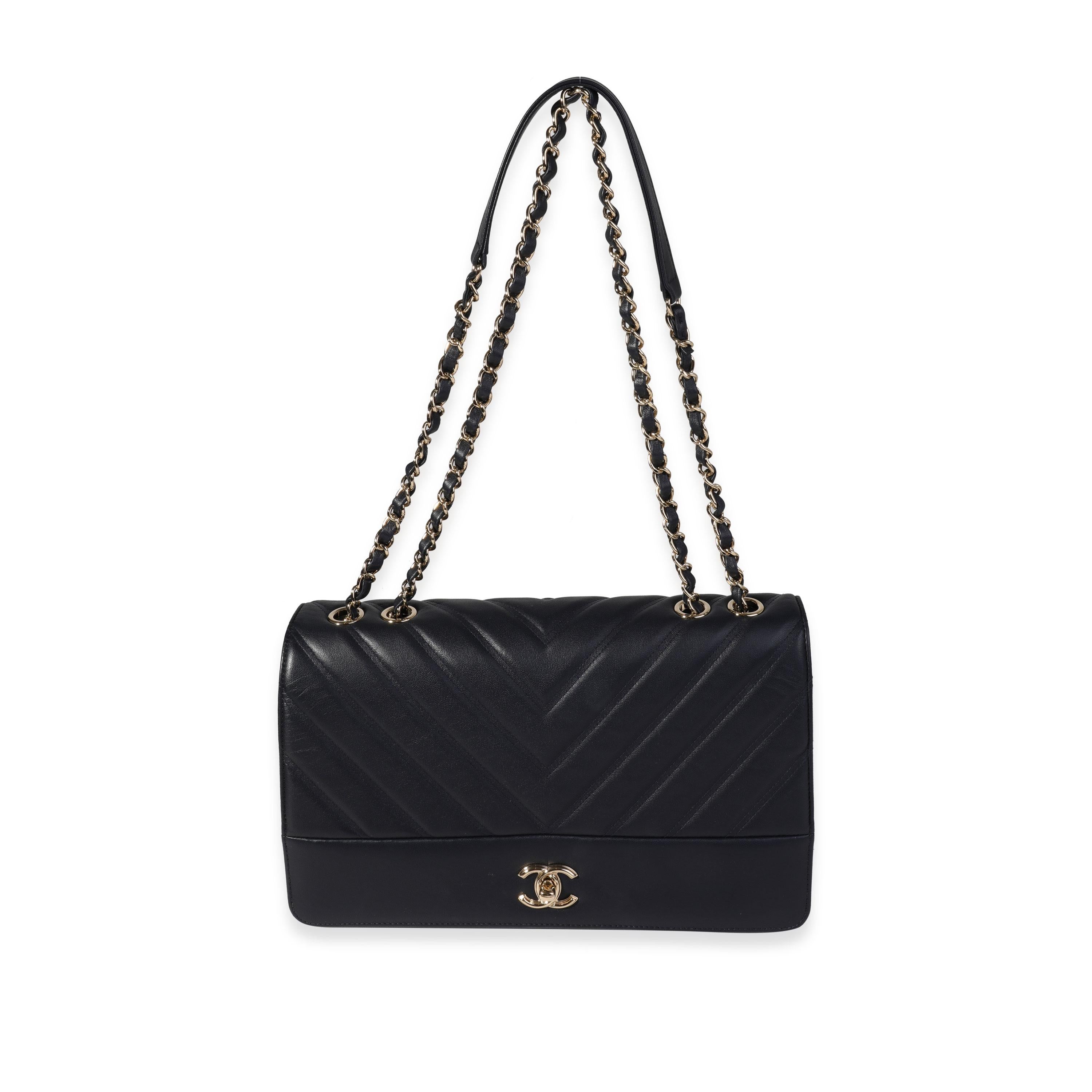 Listing Title: Chanel Navy Chevron Quilted Leather Single Flap Bag
SKU: 121131
Condition: Pre-owned 
Handbag Condition: Very Good
Condition Comments: Very Good Condition. Some plastic to hardware. Light scuffing to corners and throughout exterior.