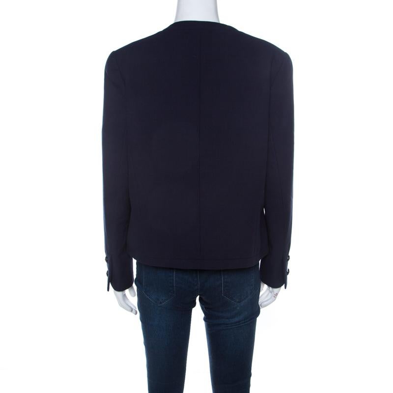 Picked from Chanel's prized collection of clothes is this gorgeous jacket that delights our sight with its colour and simple shape. The jacket arrives in navy blue with buttons on the long sleeves, an open front and textures all over.

Includes: The