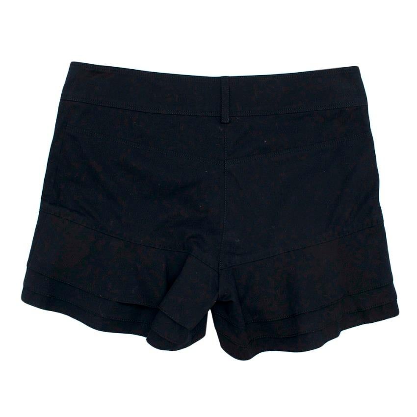 Chanel Navy Cotton Mid-rise Frill Shorts 

- Shorts with belt loops
- Silver tone textured logo button and zip fastening 
- 3 tiered frilled shorts
- Light denim feel

Materials:
- 97% Cotton
- 3% Elastane
- Machine washable

Made in Italy

Please