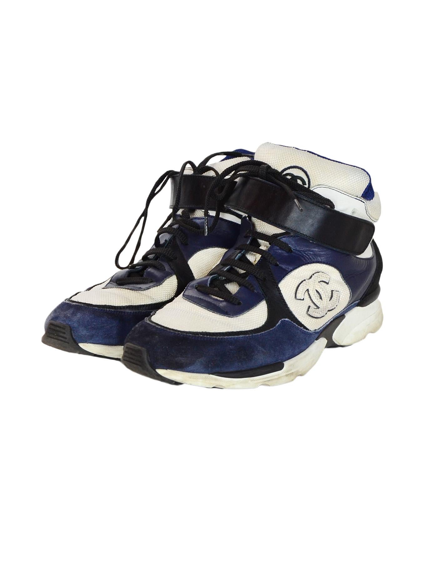 Chanel Navy/Cream Hi Top Men's Sneakers W/ CC Logo Sz 42

Made In: Italy
Color: Navy, cream, black
Materials: Leather, suede, woven, and rubber 
Closure/Opening:  Lace up and velcro strap
Overall Condition: Good pre-owned condition with exception of