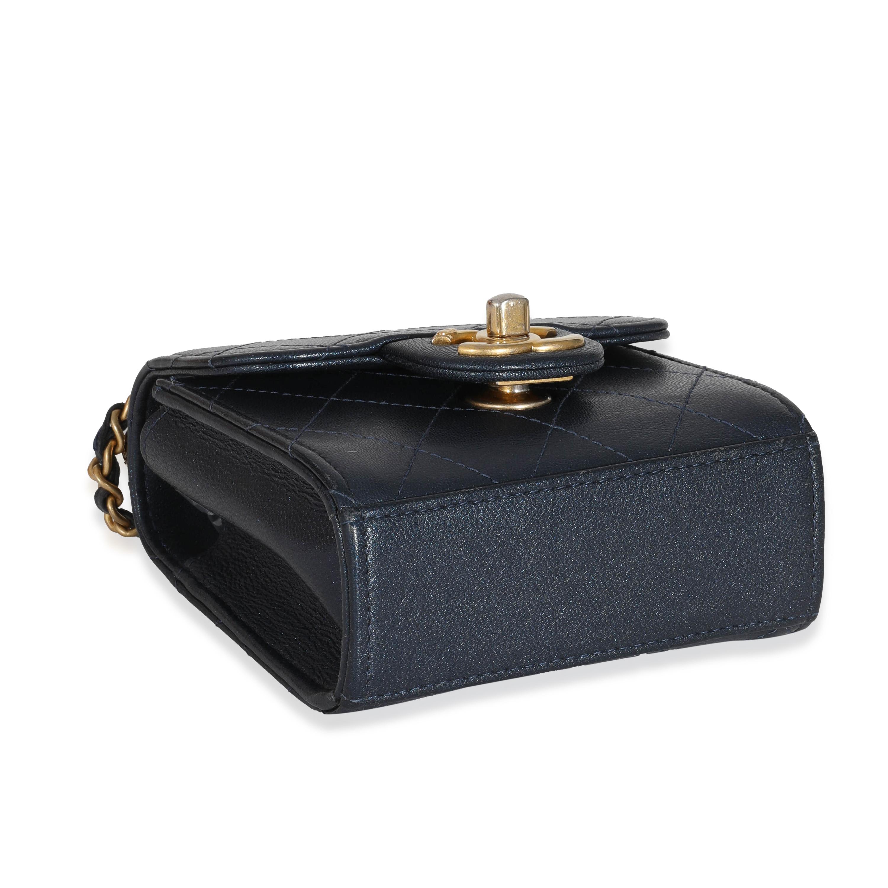 Listing Title: Chanel Navy Goatskin Chic Pearls Mini Flap Bag
SKU: 131801
Condition: Pre-owned 
Condition Description: A timeless classic that never goes out of style, the flap bag from Chanel dates back to 1955 and has seen a number of updates. The