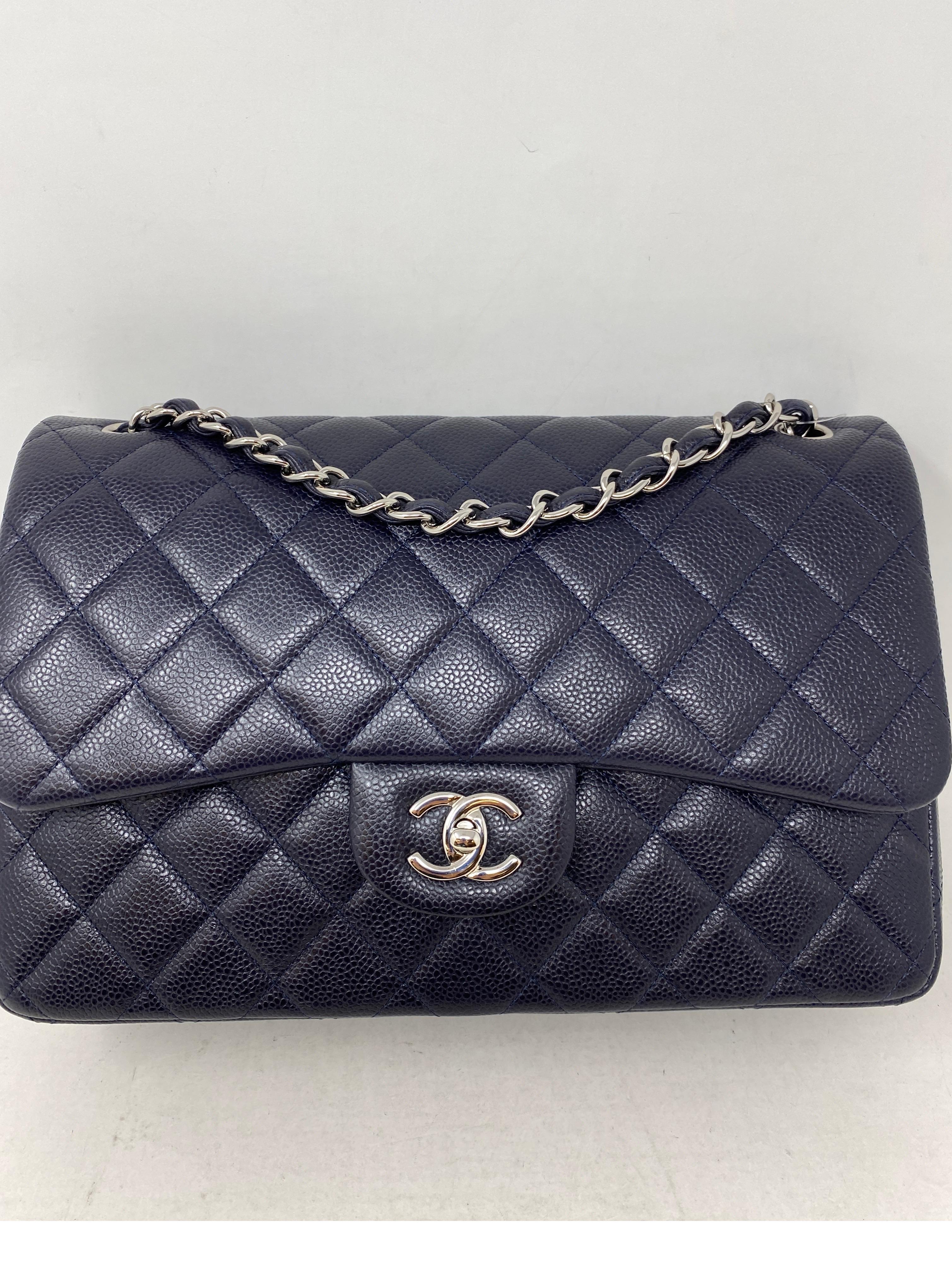 Chanel Navy Jumbo Double Flap Bag. Excellent condition like new. Bag was never used. Stayed in box. Dark navy blue caviar leather. Double flap classic bag. Can be worn crossbody or doubled as a shoulder bag. New retail is $9500 plus tax at Chanel.