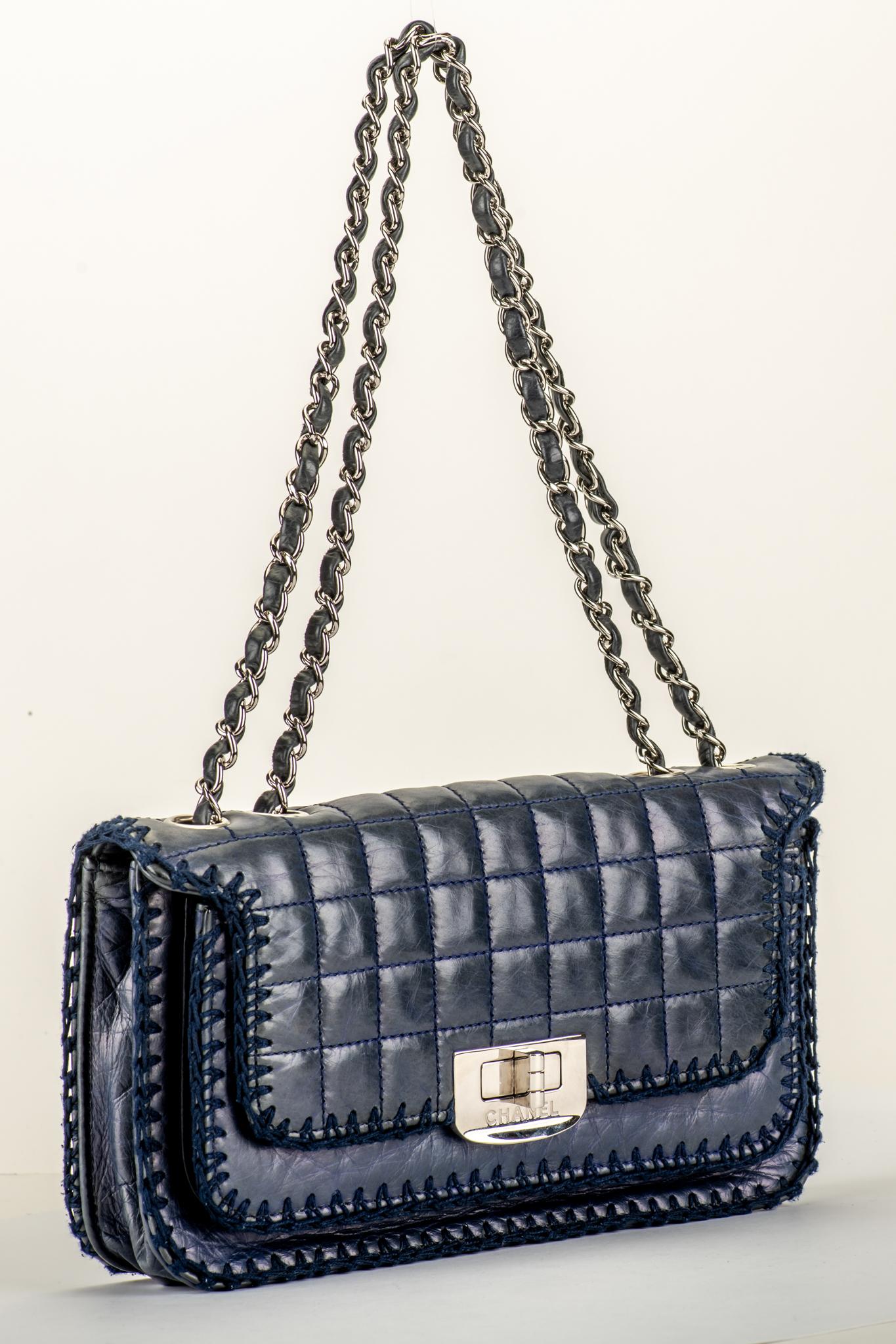 Chanel navy blue leather flap bag with crochet trim. Shoulder drop 9.5/17. Comes with hologram and dust cover.