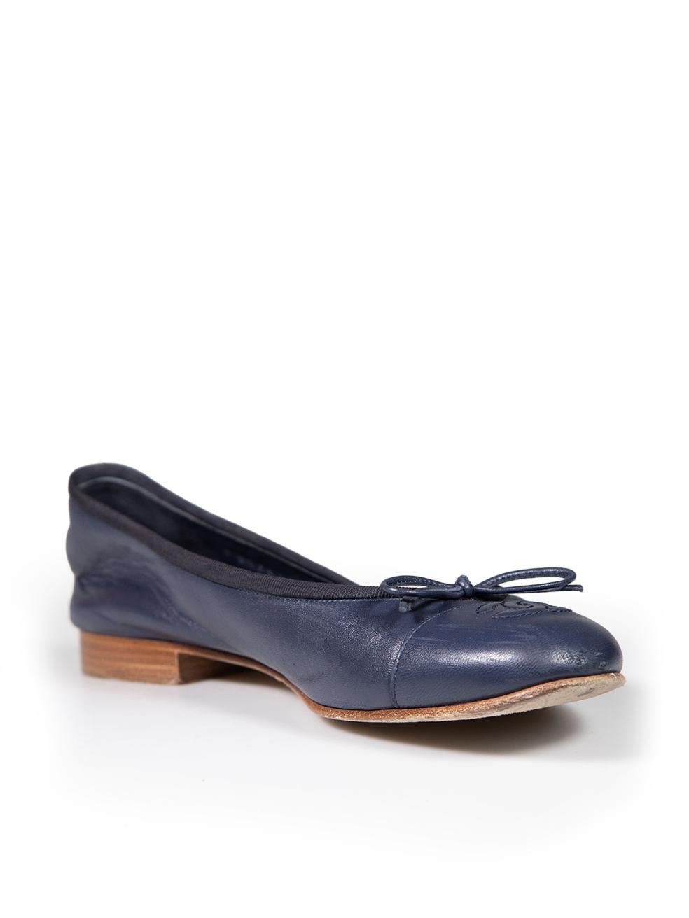 CONDITION is Good. Minor wear to flats is evident. Light scratches and abrasions to the tip and rear of both shoes on this used Chanel designer resale item.
 
 
 
 Details
 
 
 Navy
 
 Leather
 
 Flats
 
 Round toe
 
 Bow detail
 
 CC Logo