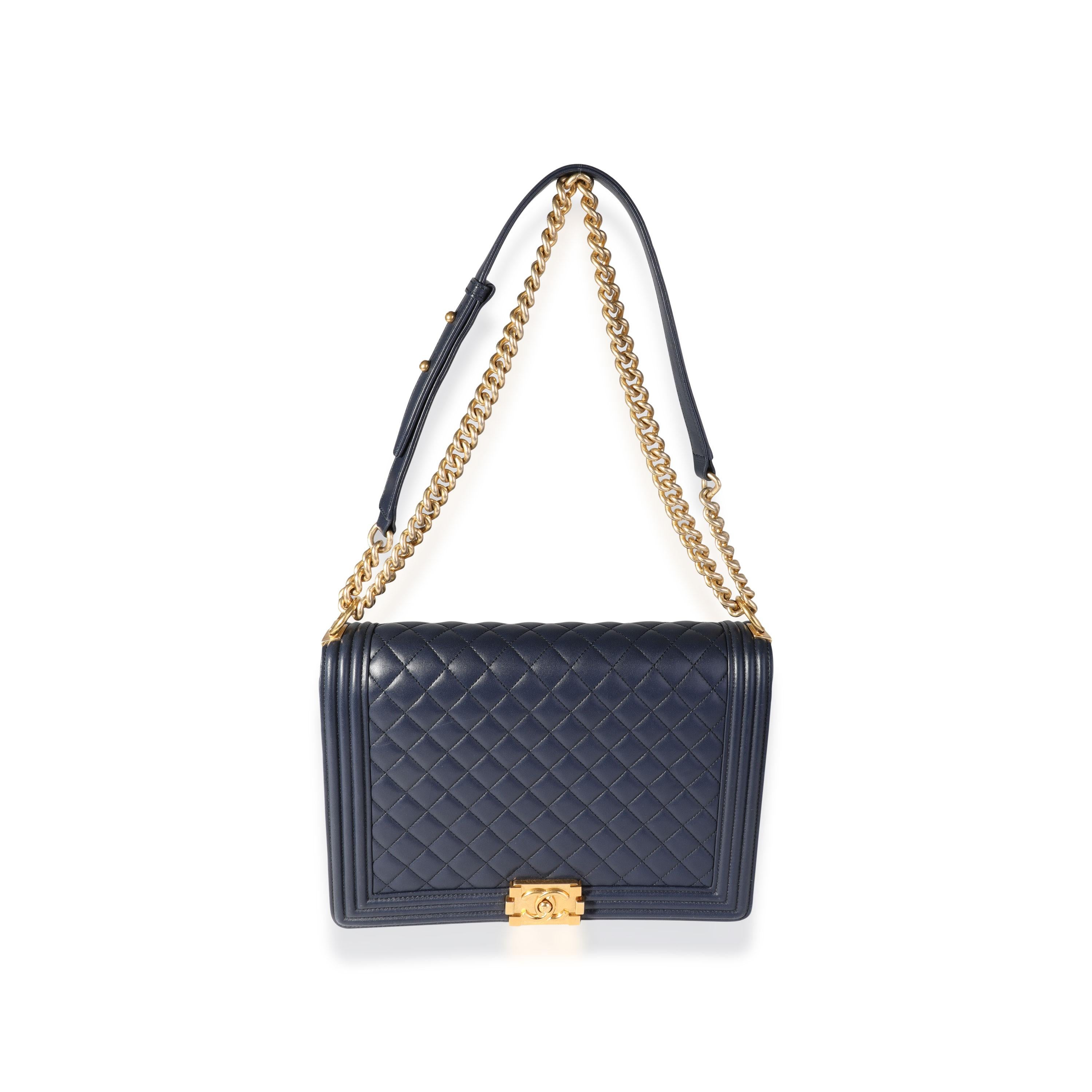 Listing Title: Chanel Navy Quilted Lambskin Large Boy Bag
SKU: 118812
Condition: Pre-owned (3000)
Handbag Condition: Very Good
Condition Comments: Wear to corners. Scratches on interior.
Brand: Chanel
Origin Country: Italy
Handbag Silhouette: