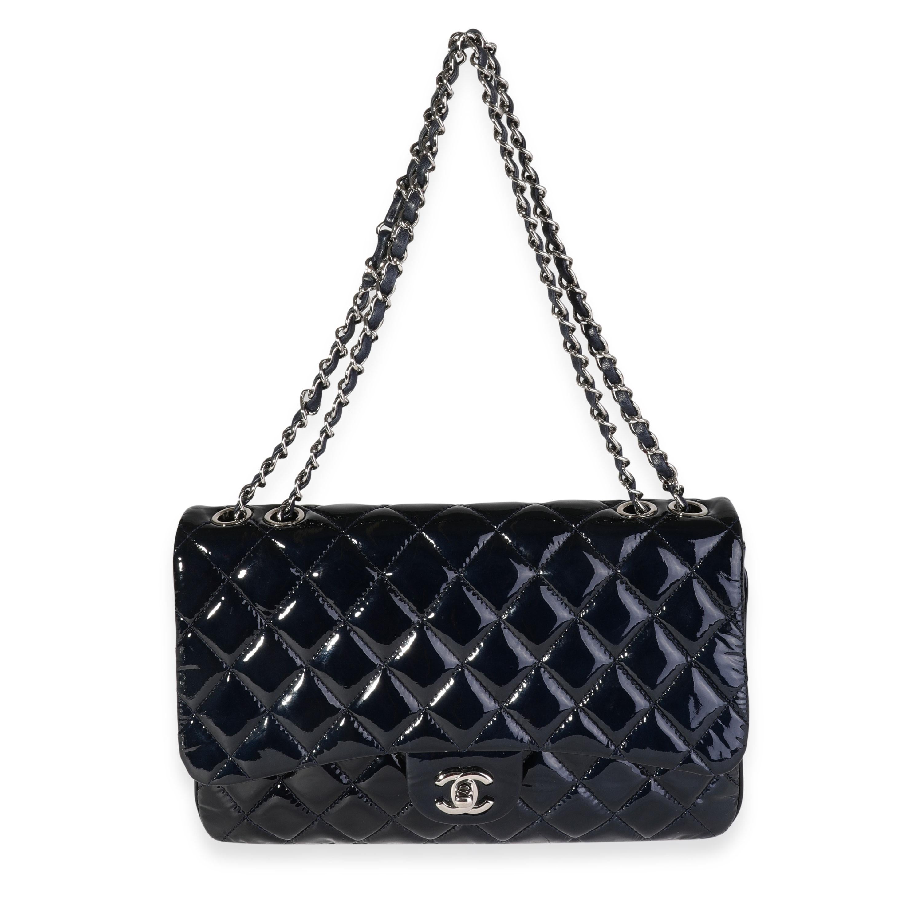 Listing Title: Chanel Navy Quilted Patent Leather Accordion Flap Bag
SKU: 119364
Condition: Pre-owned (3000)
Handbag Condition: Very Good
Condition Comments: Scuffing and discoloration to leather trim and base. Marks to patent. Scratching to