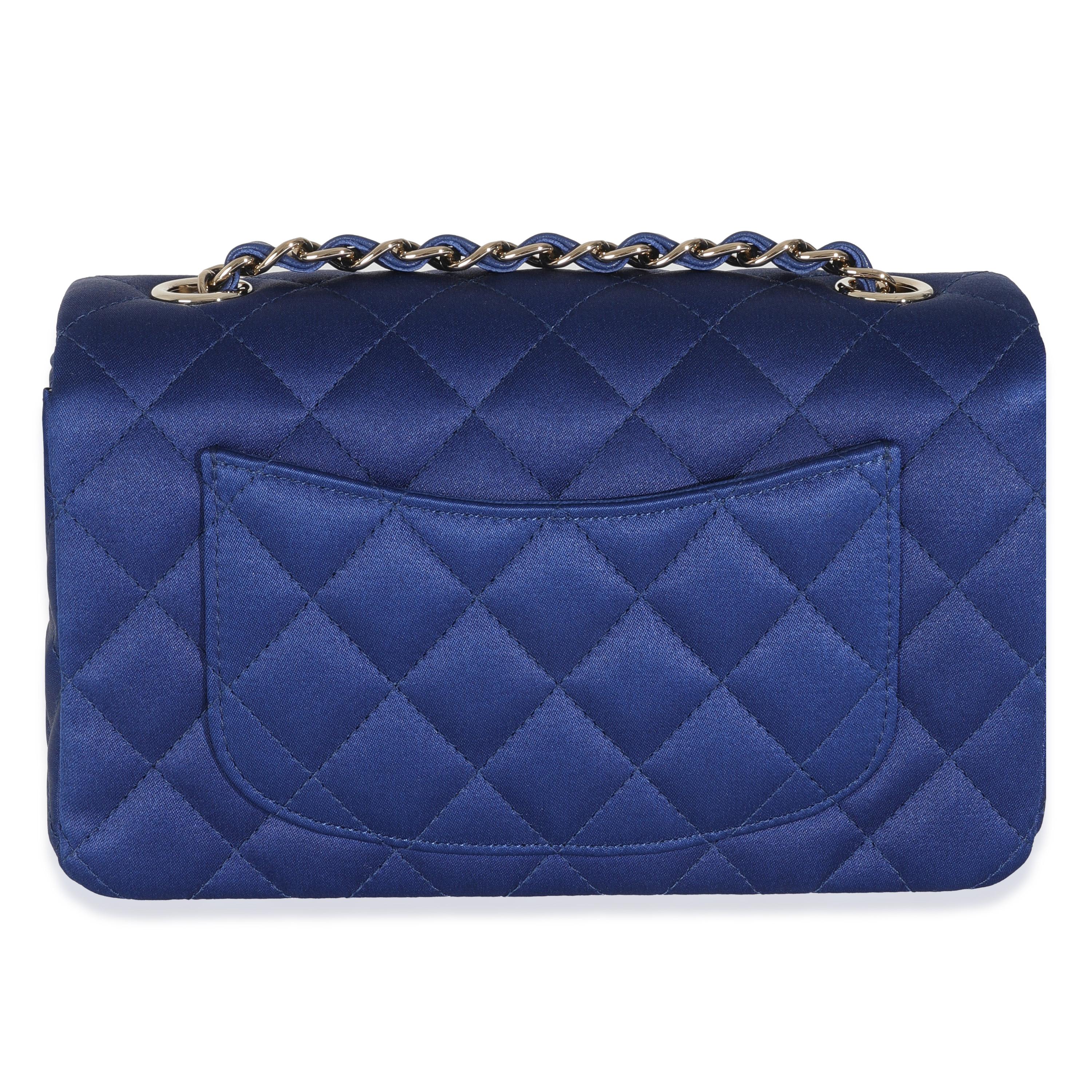 Listing Title: Chanel Navy Quilted Satin Mini Rectangular Classic Flap
SKU: 146697
Condition: Pre-owned 
Condition Description: A timeless classic that never goes out of style, the flap bag from Chanel dates back to 1955 and has seen a number of