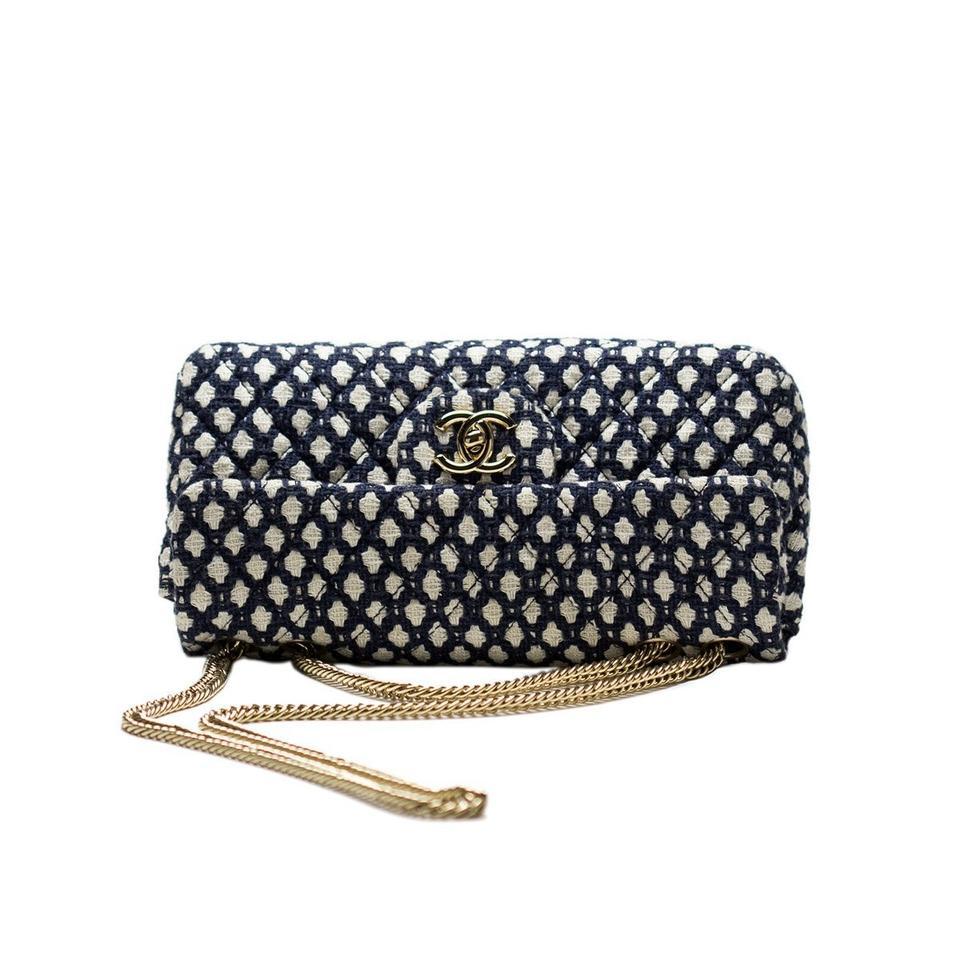 Chanel Small Classic Flap Navy Vintage Resort Blue White Tweed Flap Bag

Year: 2008 {VINTAGE 16 Years}
Gold hardware
Two interior pockets
Navy blue lambskin lined interior
Gold bijoux chain
5.5