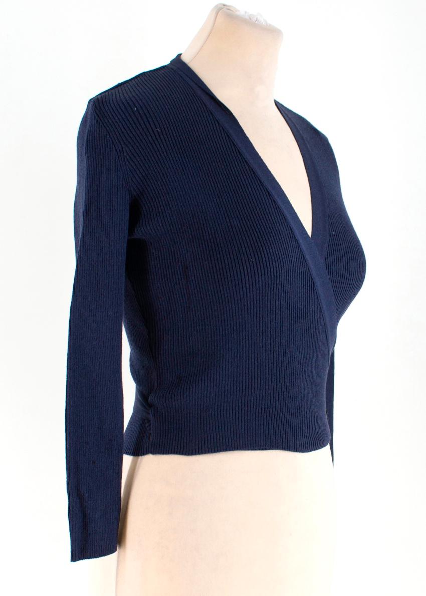 Chanel Navy Silk Wrap Cardigan

-Navy wrap around cardigan
-Cropped length 
-Ribbed material
-V neck

Please note, these items are pre-owned and may show signs of being stored even when unworn and unused. This is reflected within the significantly