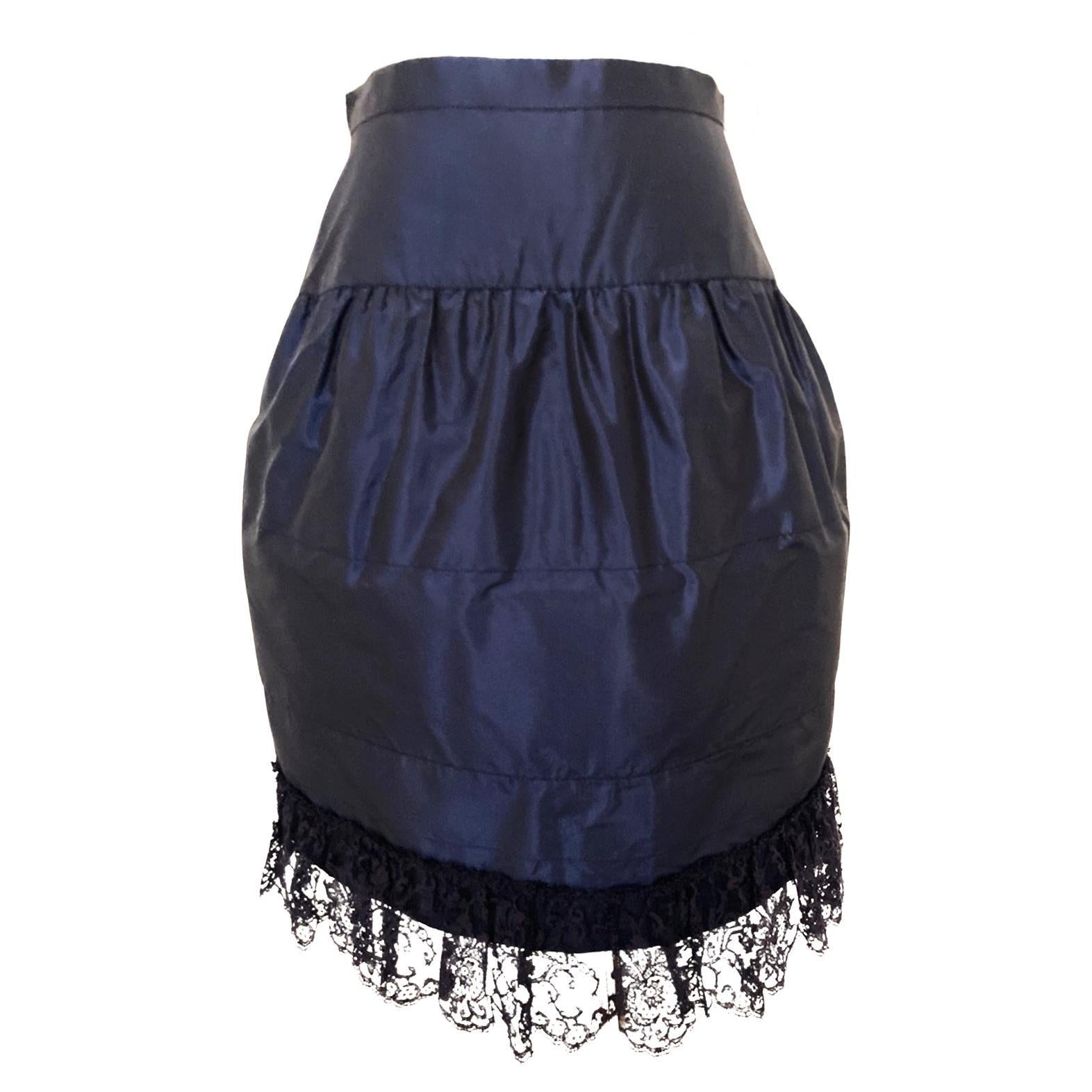 Chanel aw 1994 iconic collection piece. Beautifully constructed skirt featuring a textured shiny fabric, a bottom lace finishing. 
Slightly padded vertical stripes make elegant movements.
Center back zip opening with hidden hook. 
Made in