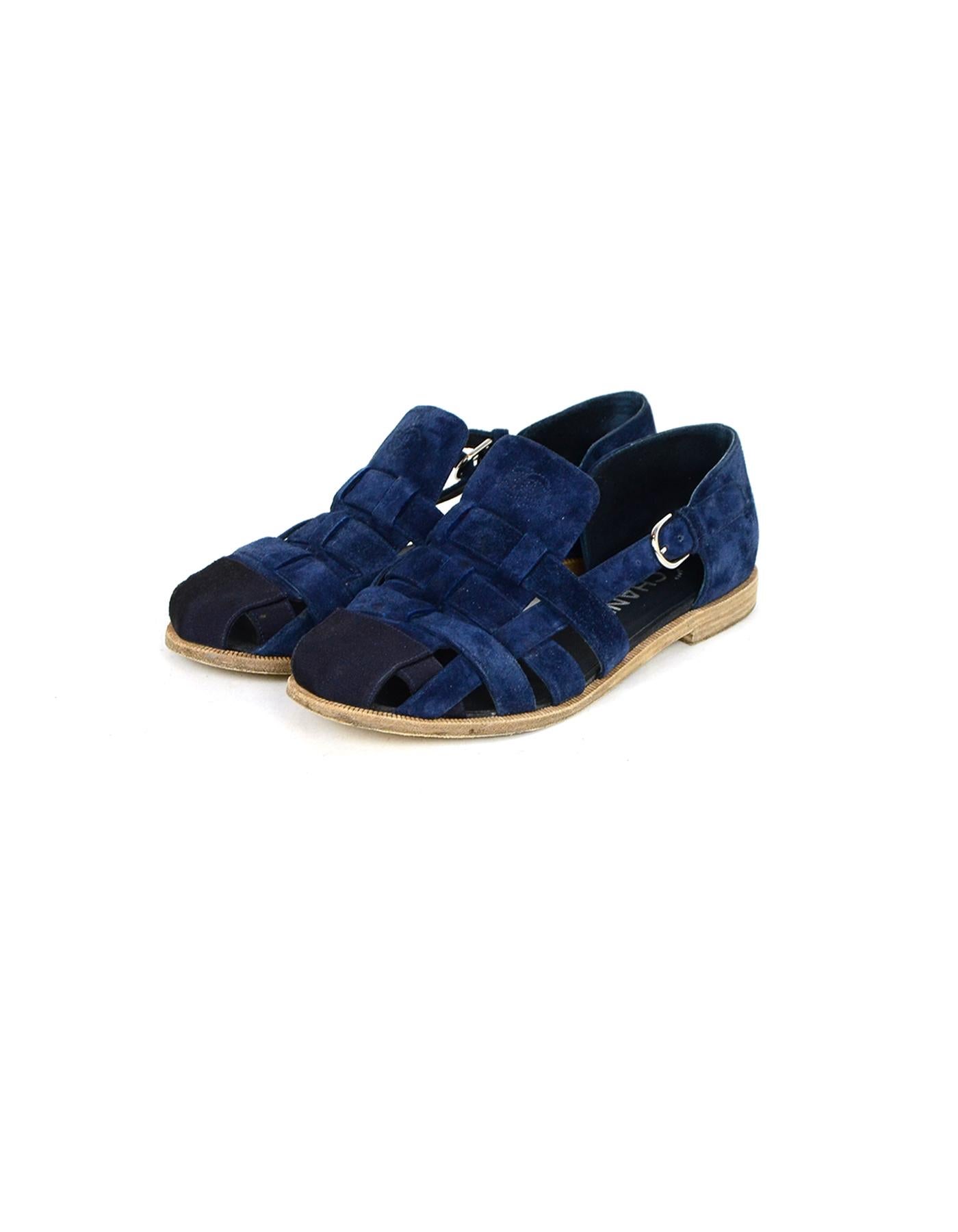 Chanel Navy Suede Woven Sandals sz 37.5

Made In: Italy
Color: Navy
Hardware: Silvertone
Materials: Suede
Closure/Opening: Side buckle
Overall Condition: Very good pre-owned condition, minor wear on the insoles and wear on the soles, some marks on
