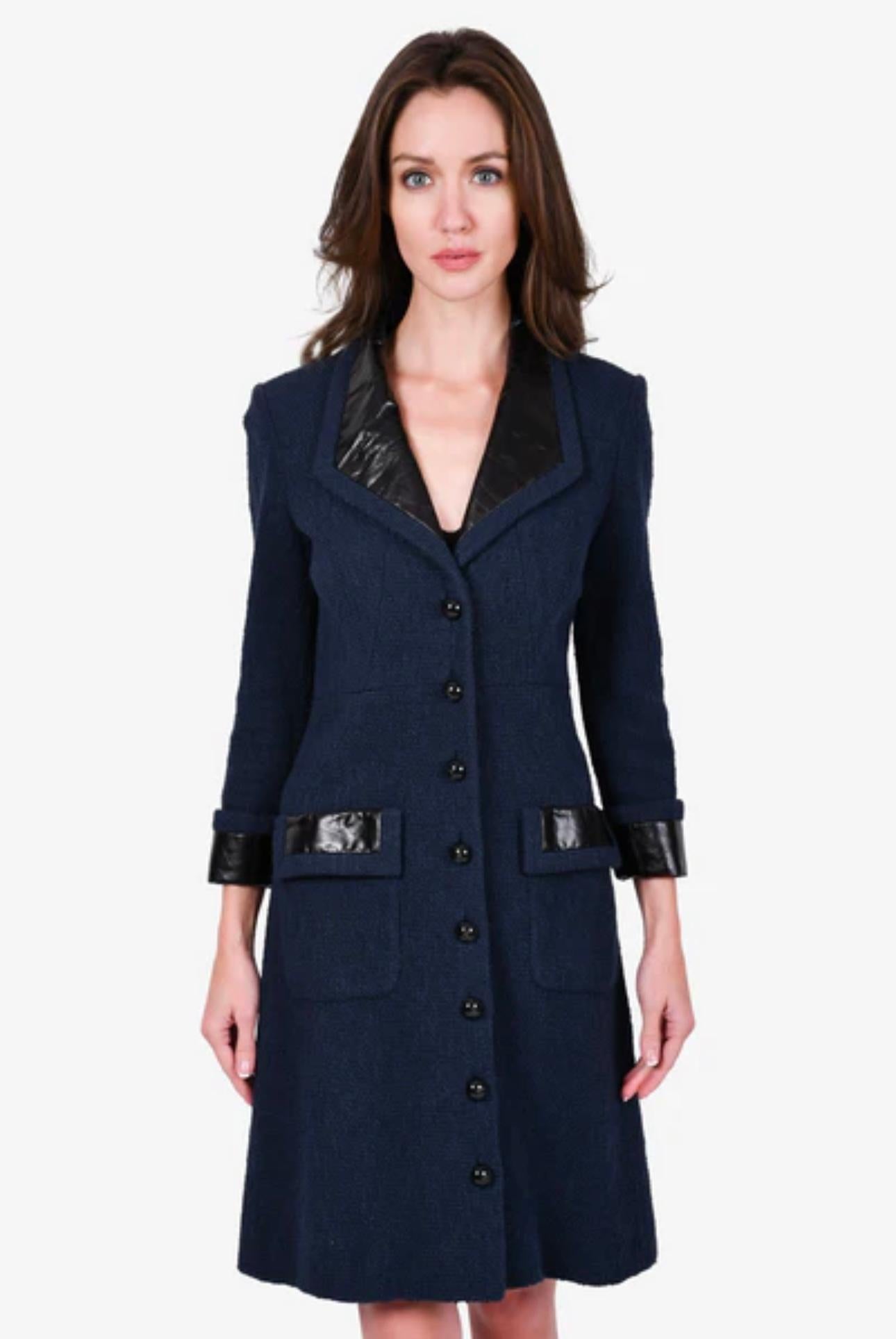 Fabulous Chanel navy tweed coat with balky leather accents at collar and cuffs
- CC logo massive buttons
- tonal silk lining with camellias
Size mark 40 FR. Condition is pristine, no signs of wear