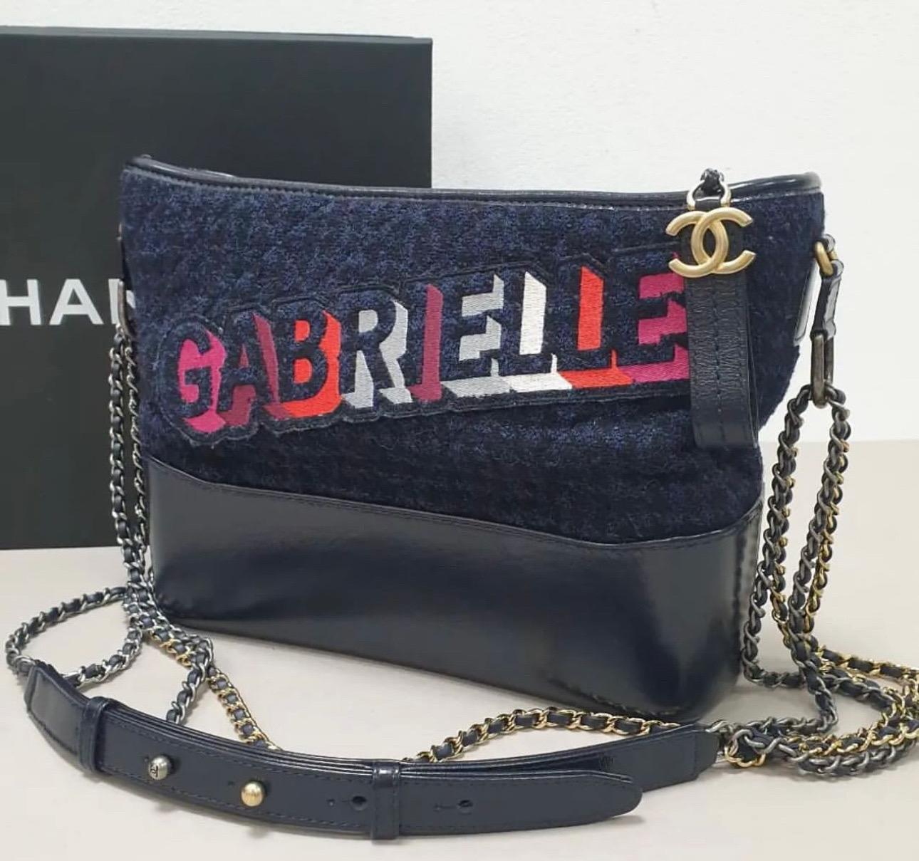 Chanel navy leather and tweed Gabrielle bag. Can be worn shoulder or double body strap


This Gabrielle bag from the House of Chanel exudes the right amount of class and style. Crafted from black blue tweed and leather this bag is adorned with a
