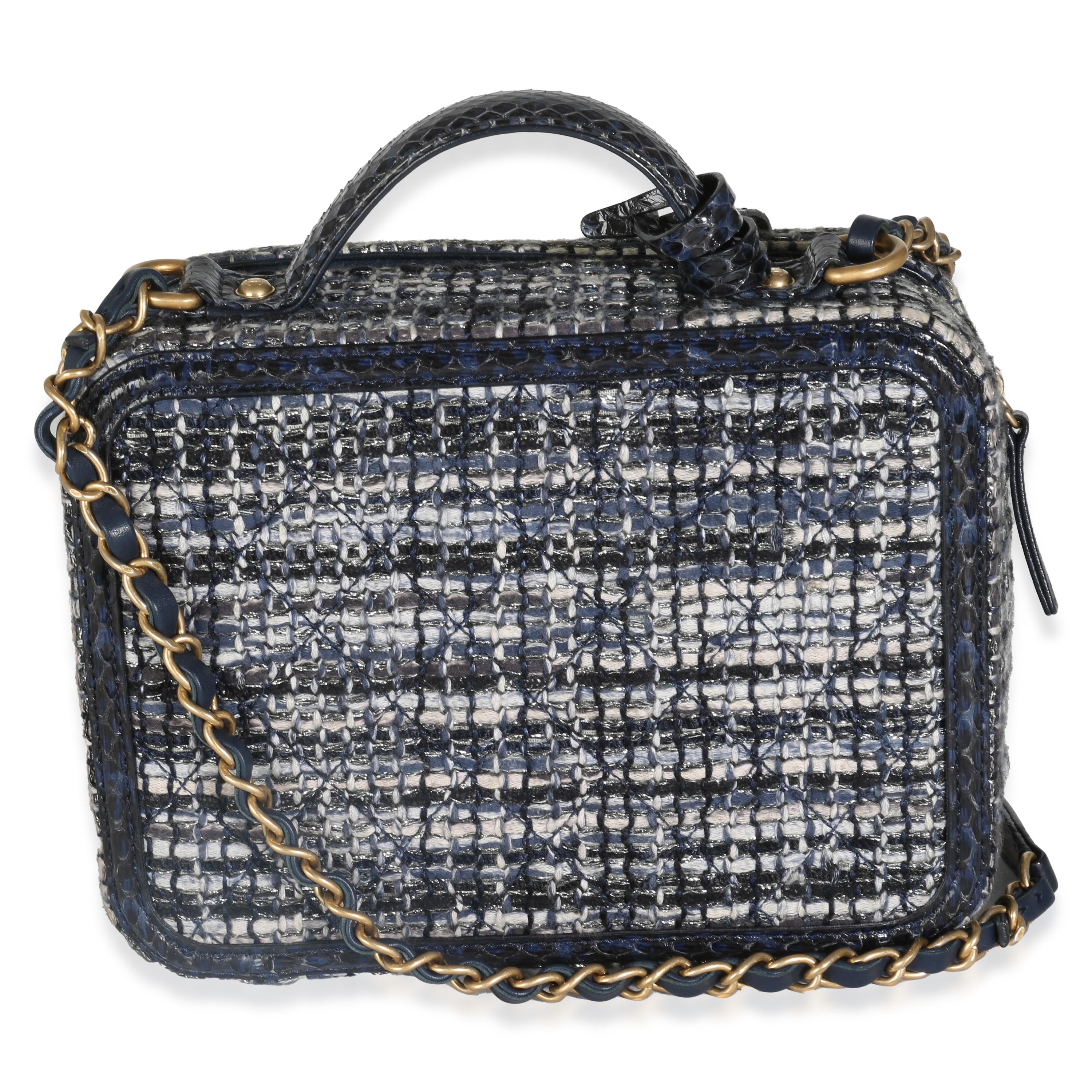 Listing Title: Chanel Navy Tweed Python Medium Filigree Vanity Case
SKU: 142835
Condition: Pre-owned 
Condition Description: Intrinsically Chanel, the medium Coco top handle bag was named after the maison's founder. Introduced in 2015, the bag
